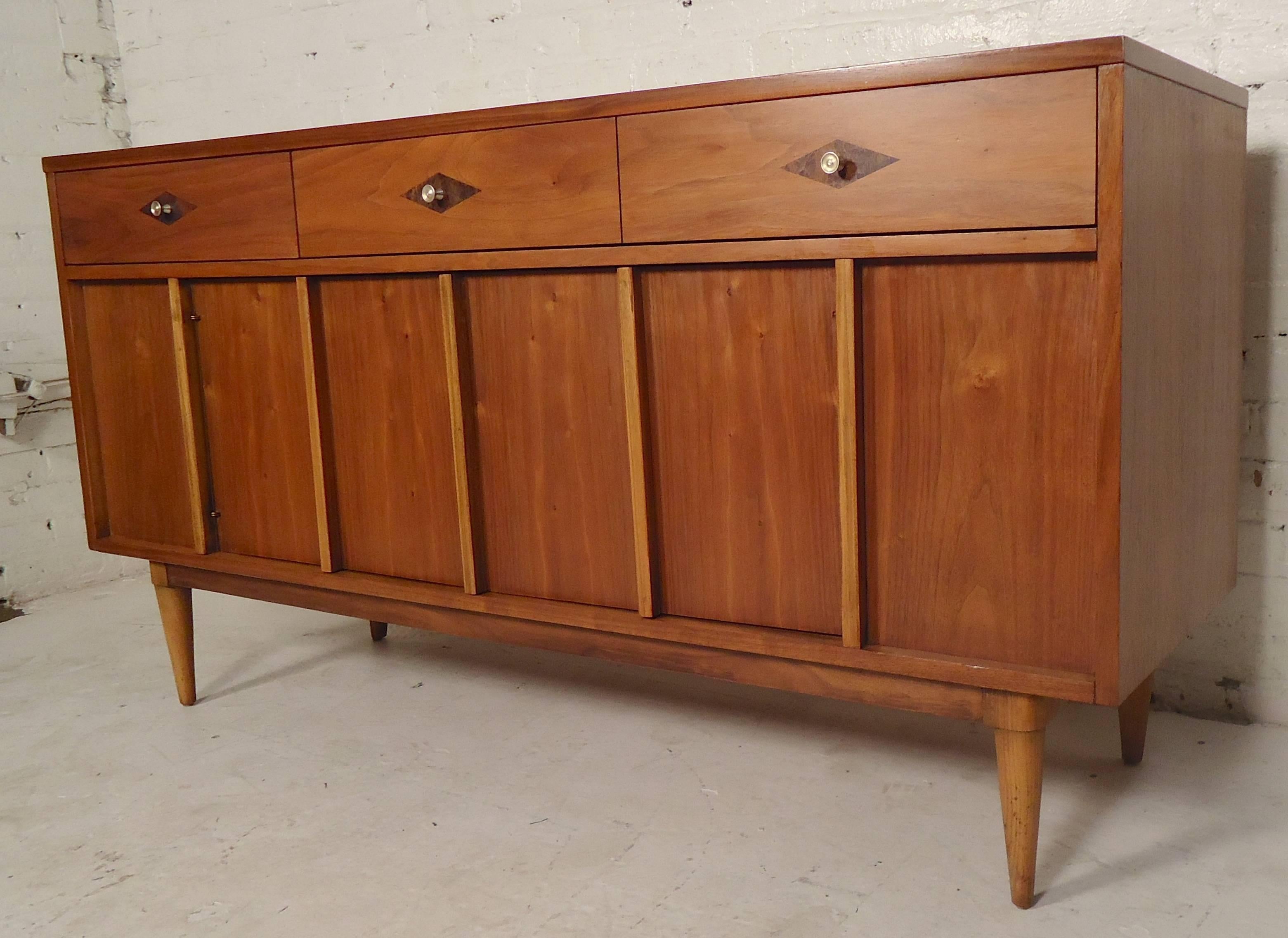 Restored vintage modern credenza with drawer and cabinet storage. Walnut grain with accenting rosewood diamond shaped inlay.

(Please confirm item location - NY or NJ - with dealer).
   