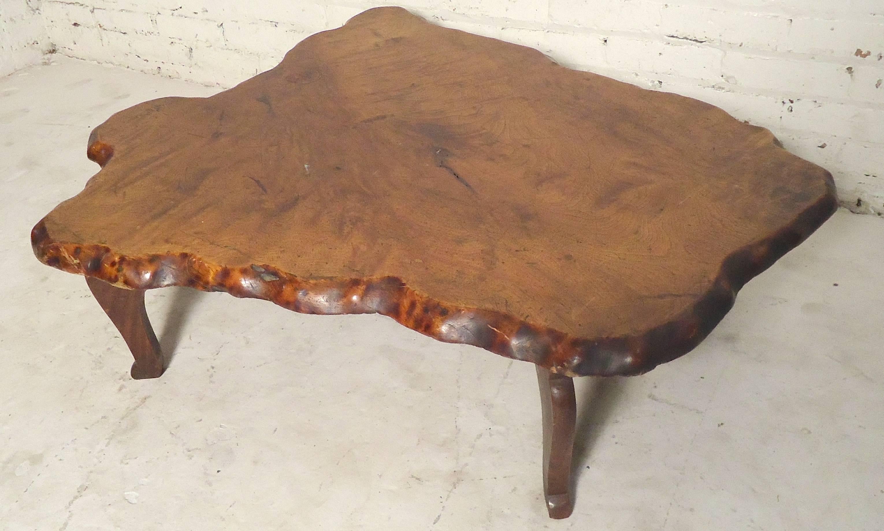 One of a kind low table with a fantastic free-form shape. Top has a great grain pattern, with four sculpted legs.

(Please confirm item location NY or NJ with dealer).
 