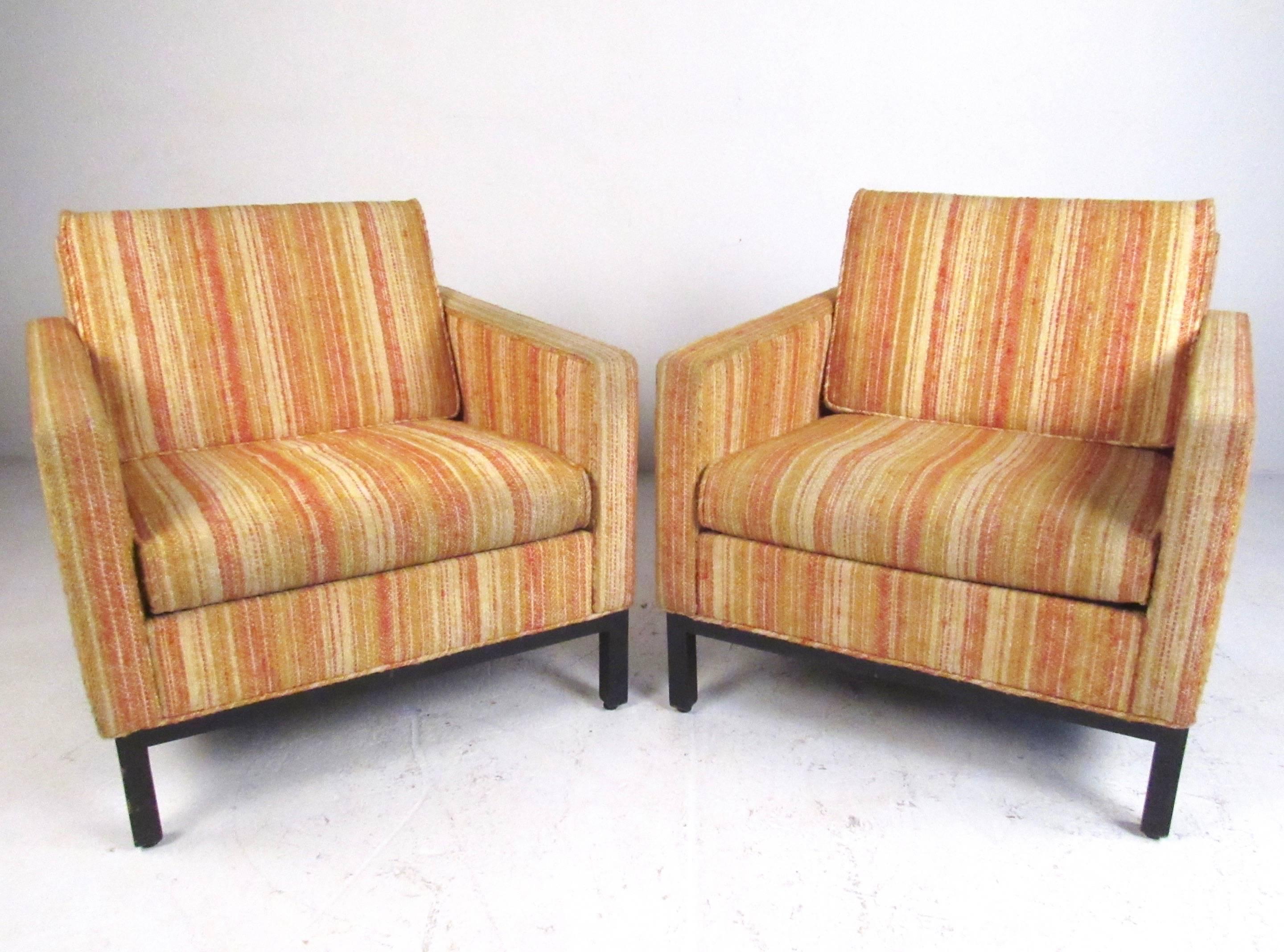 This stylish pair of Mid-Century Modern lounge chairs by Barrit, features vintage upholstery by Kravet. Sturdy wood base and comfortable upholstered seats make this matching pair a unique addition to any home or business interior. Please confirm