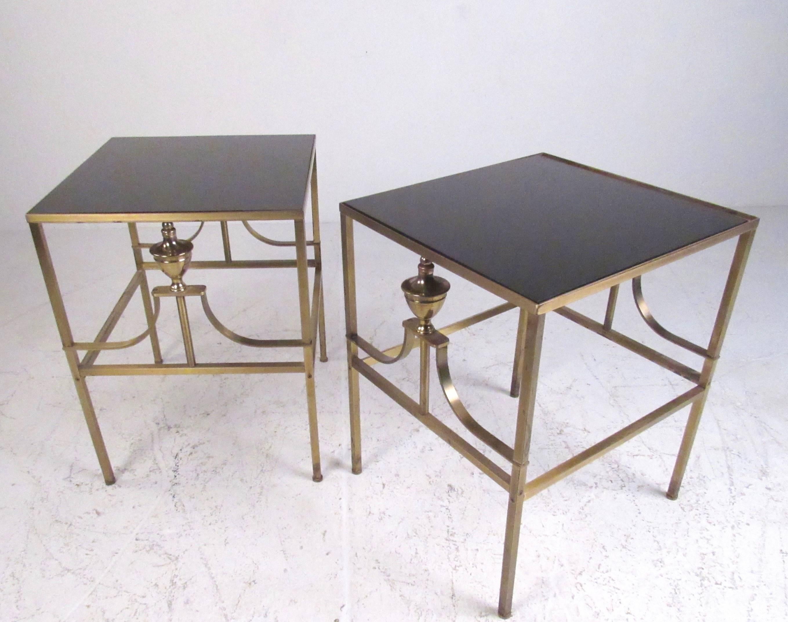 This stylish pair of vintage modern end tables boast elegant brass frames with ornate details. Patinated brass finish adds to the vintage charm of the Italian modern styled pair. Ideal pair of tables for use as sofa end tables, lamp tables, or