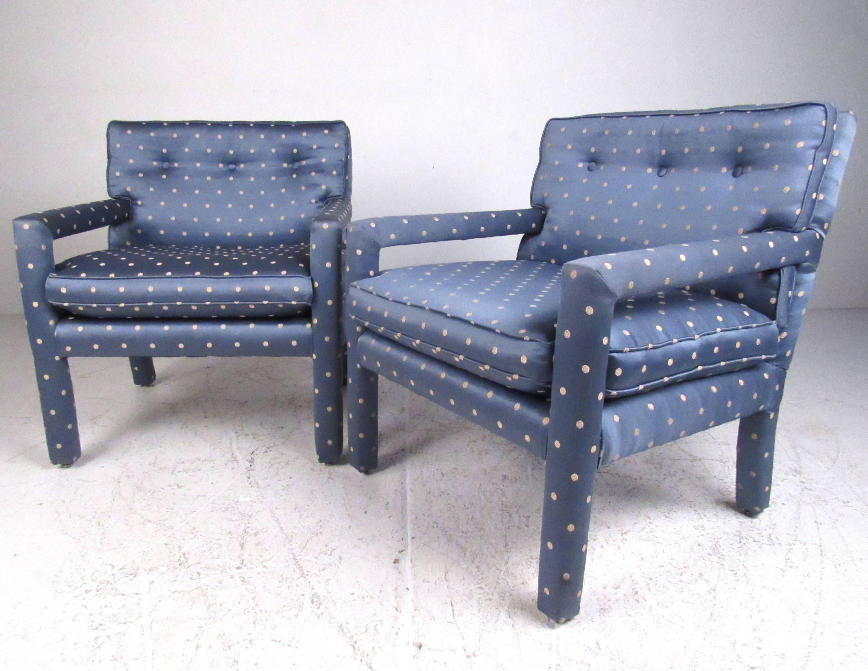 This stylish vintage modern pair of parson style side chairs feature unique tufted blue upholstery and plush padded seats. Wonderful mix of style and timeless comfort, this matching pair are perfect for home or business seating. Please confirm item