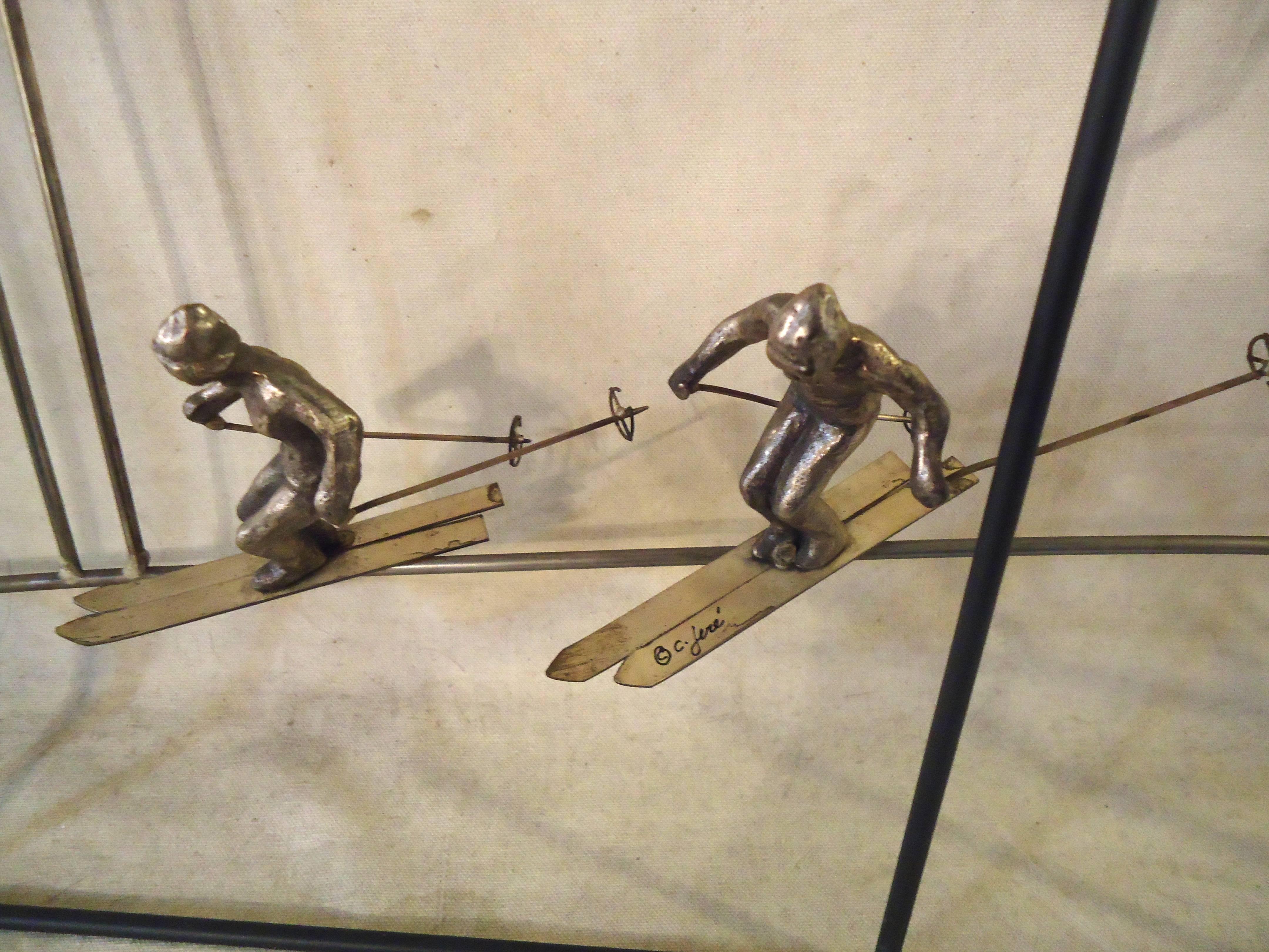 Unique Mid-Century Modern wall art depicting skiers in a wooded landscape. Interesting use of black and gold painted metal helps to give a three dimensional effect.

(Please confirm item location - NY or NJ - with dealer).
 