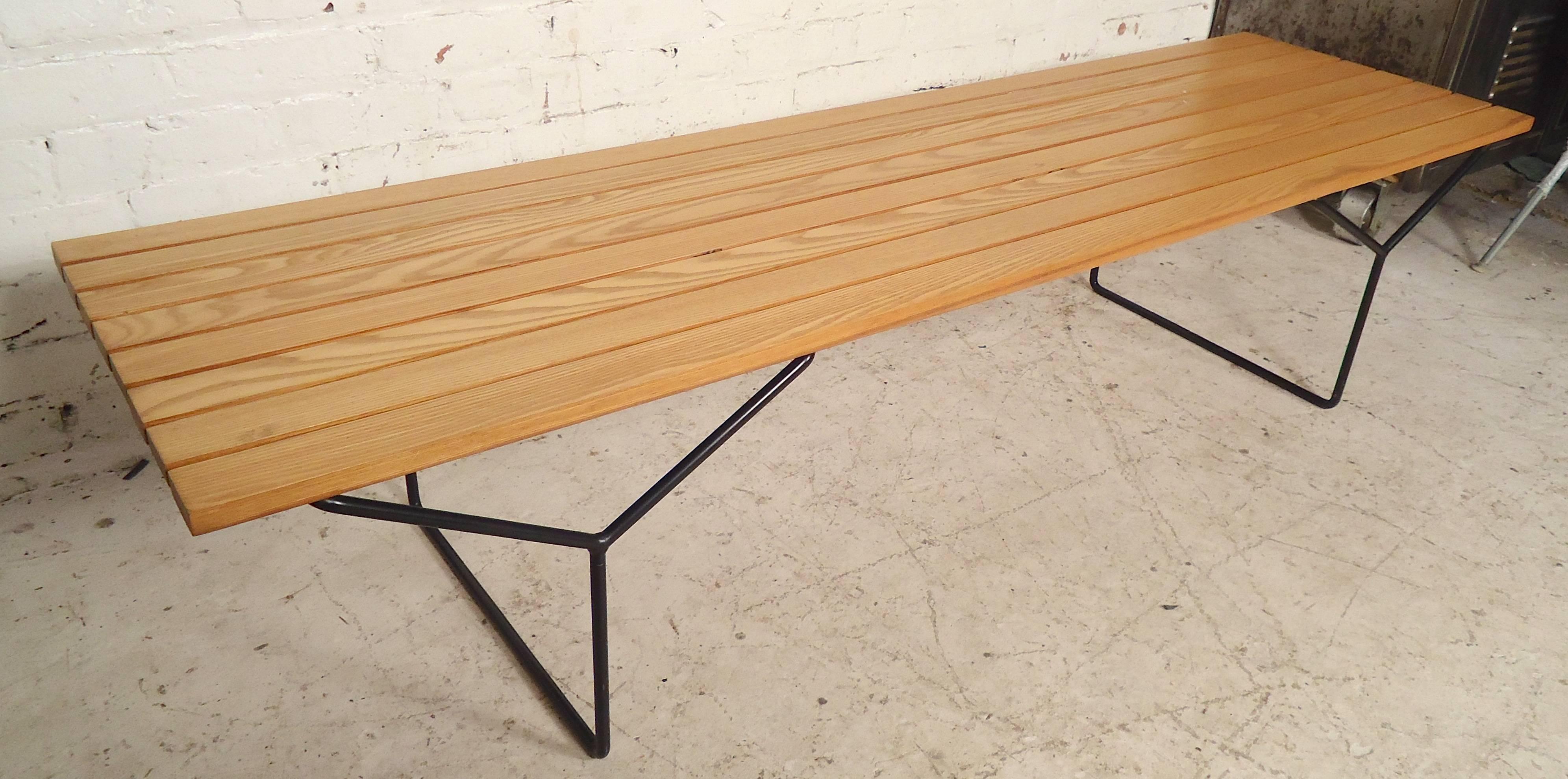 Classic Knoll bench with slat wood seating and metal 
