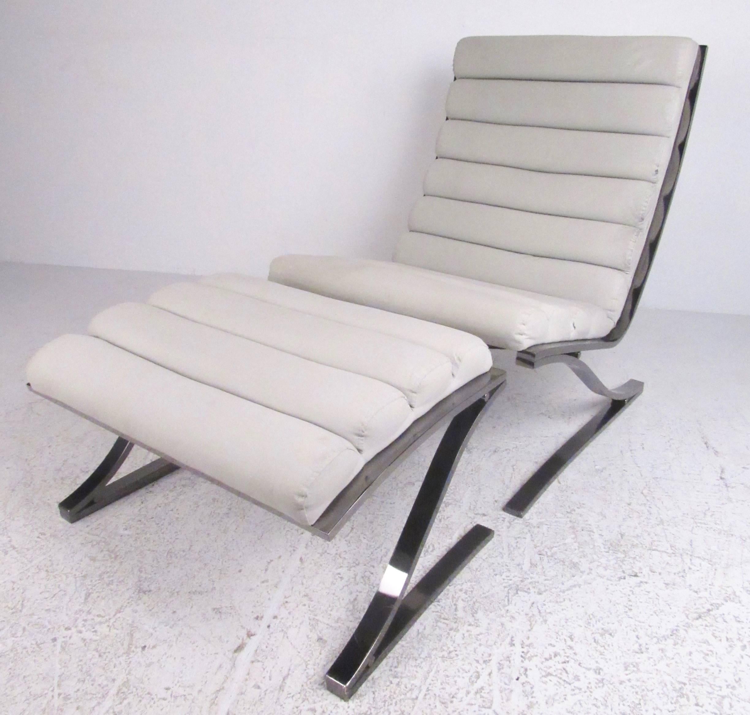 This elegant Mid-Century style lounge chair features gun metal chrome finish with ribbed upholstery, boasting a well-proportioned seating area with comfortable cantilever design. This contemporary modern lounge chair by DIA has a sleek modern design
