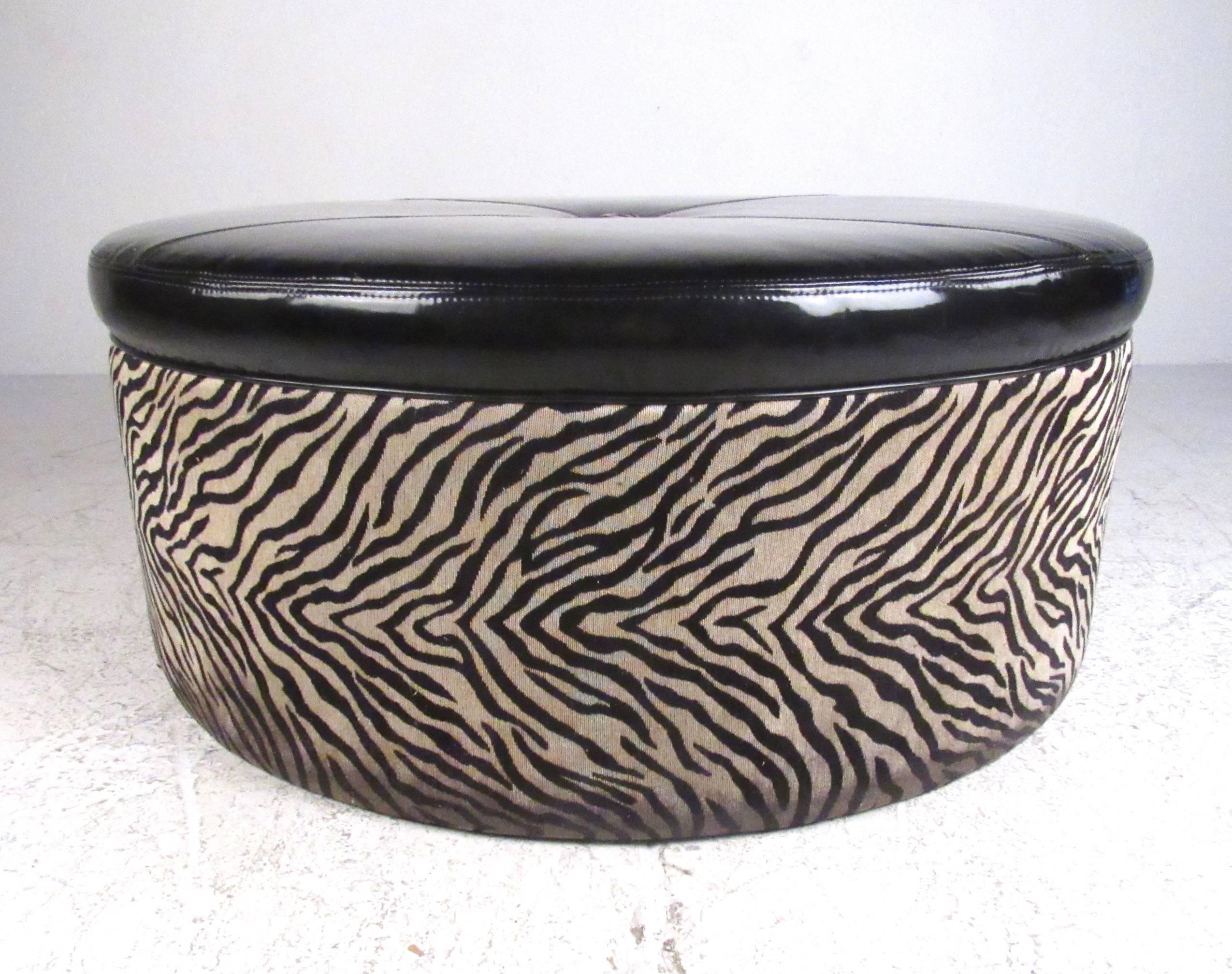 This unique faux animal skin ottoman makes a unique modern addition to any seating arrangement, offering a comfortable occasional seat or circular center piece. Faux skin print and stylish two tone upholstery make this an impressive addition to any