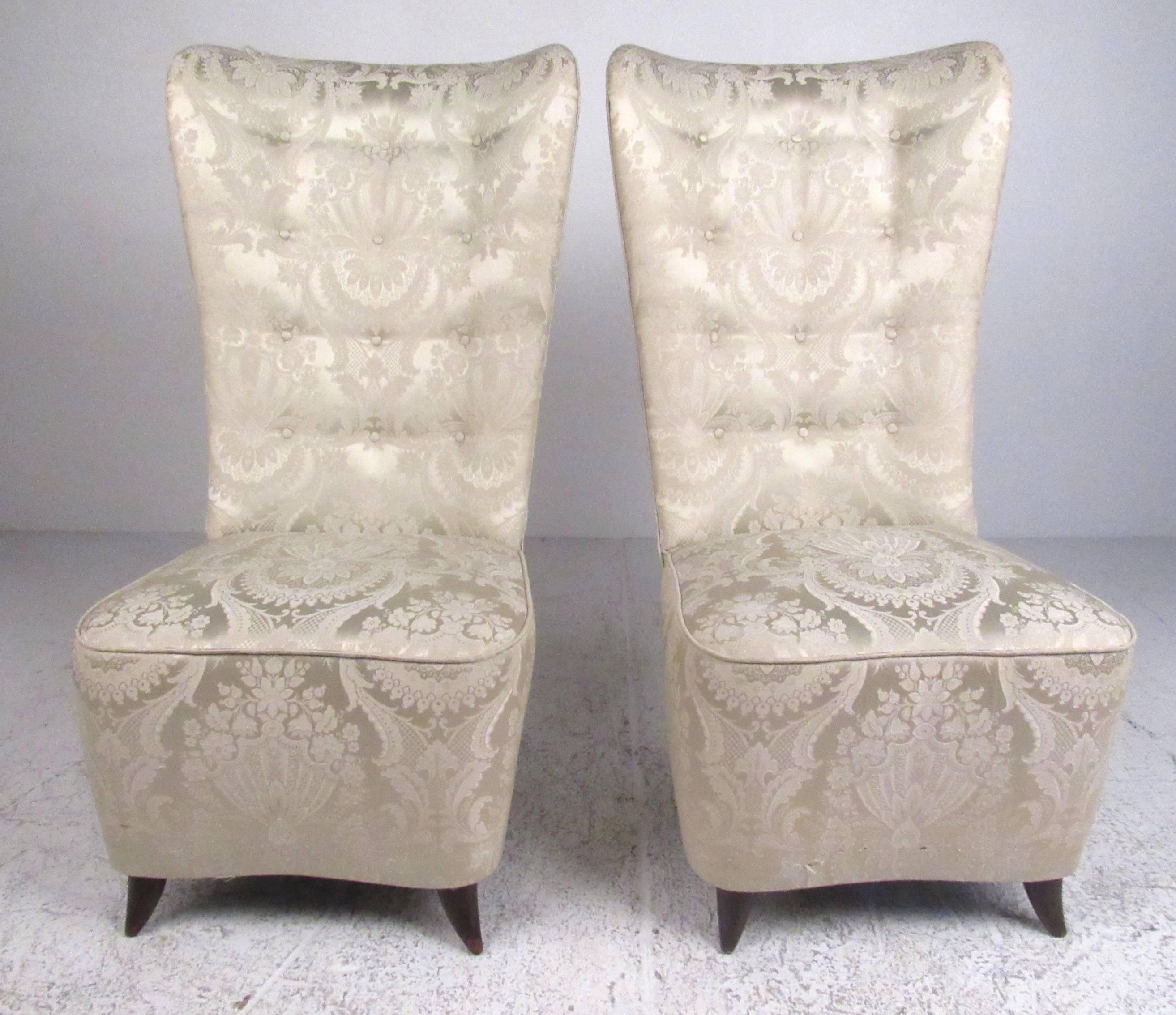 This stunning pair of elegant slipper chairs feature Mid-Century, Italian modern style similar to the style of Paolo Buffa. The sculpted high back seats feature ornate vintage upholstery, braided piping and tufted seats. The hardwood tapered legs