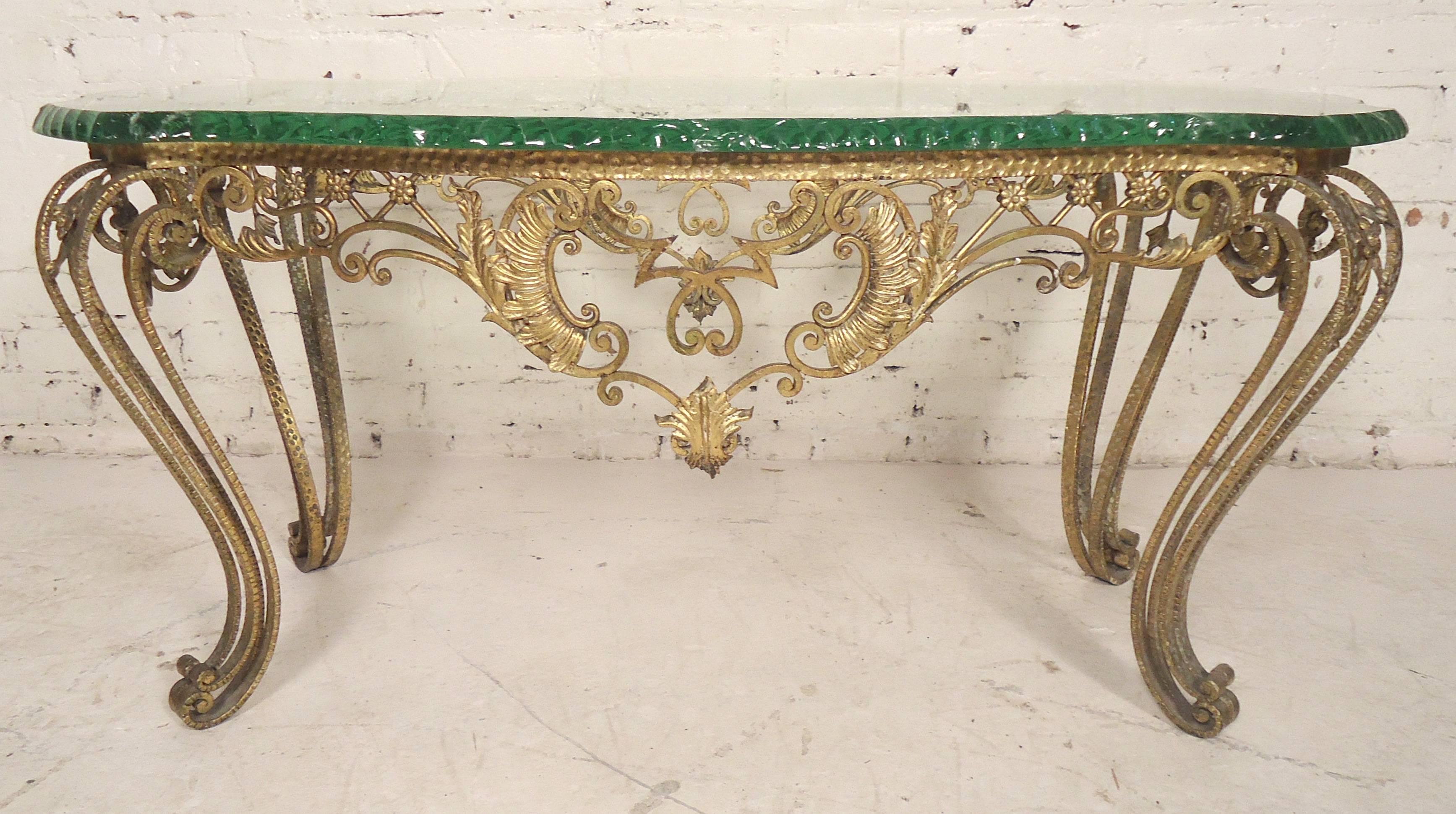 Beautiful Italian table made of hammered bronze with a thick chiselled glass top. Unique decorative flair on base with scrolling legs.

(Please confirm item location - NY or NJ - with dealer).
 