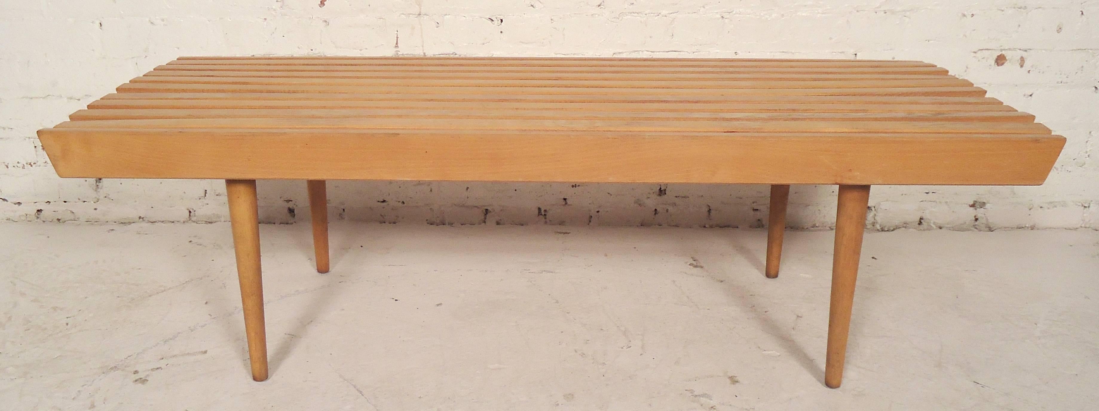 Classic vintage modern table or bench in the style of a George Nelson slat bench. Tight wood slats and tapered cone legs.

(Please confirm item location - NY or NJ - with dealer).
 