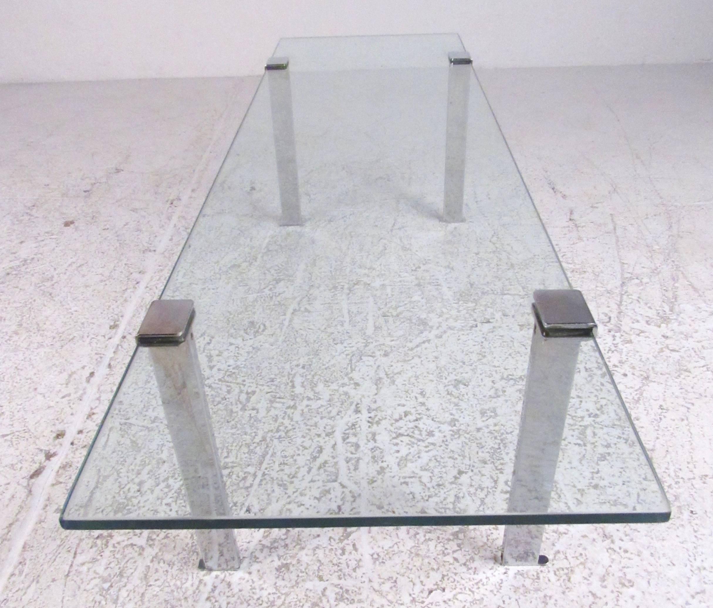 This simple modern coffee table features vintage chrome finish and rectangular glass top. Perfect size and shape for home or business seating area. Please confirm item location (NY or NJ).