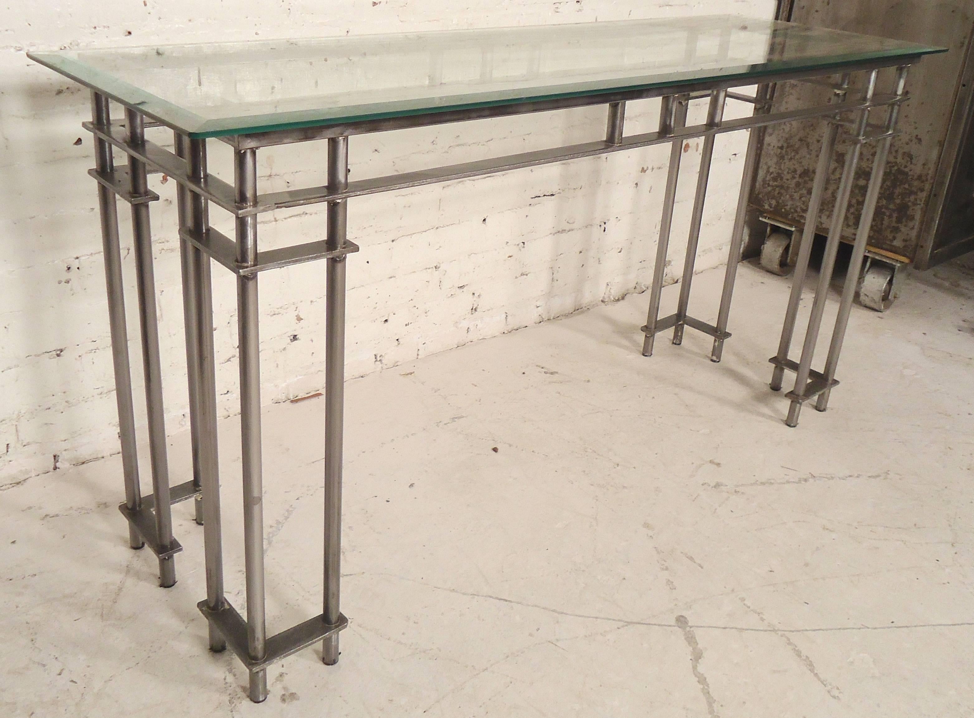Metal console table with beveled glass top, restored with a bare metal style finish.

(Please confirm item location NY or NJ with dealer).
 