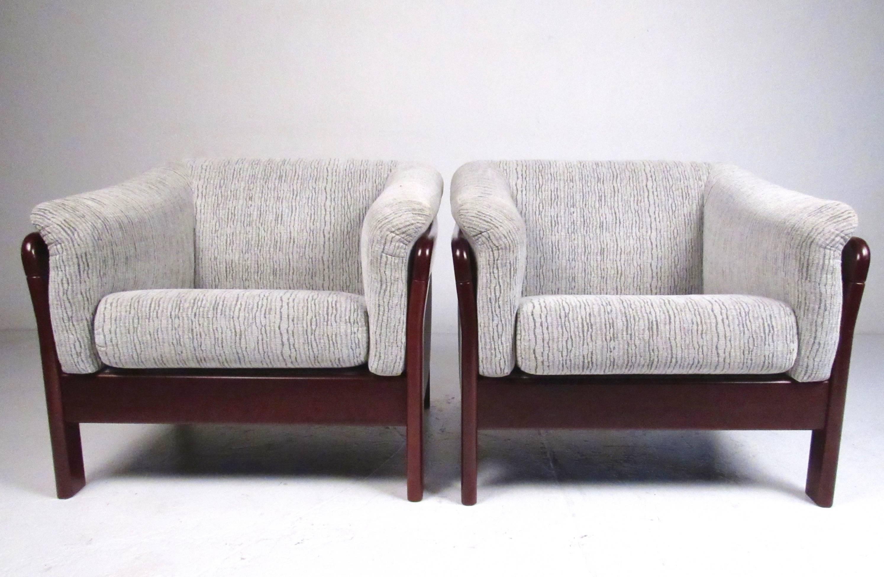 This comfortable pair of contemporary modern lounge chairs make a stylish addition to any home or business seating area. Clean lines, plush upholstery, and rich wood finish add to the appeal of the matching chair. Please confirm item location (NY or