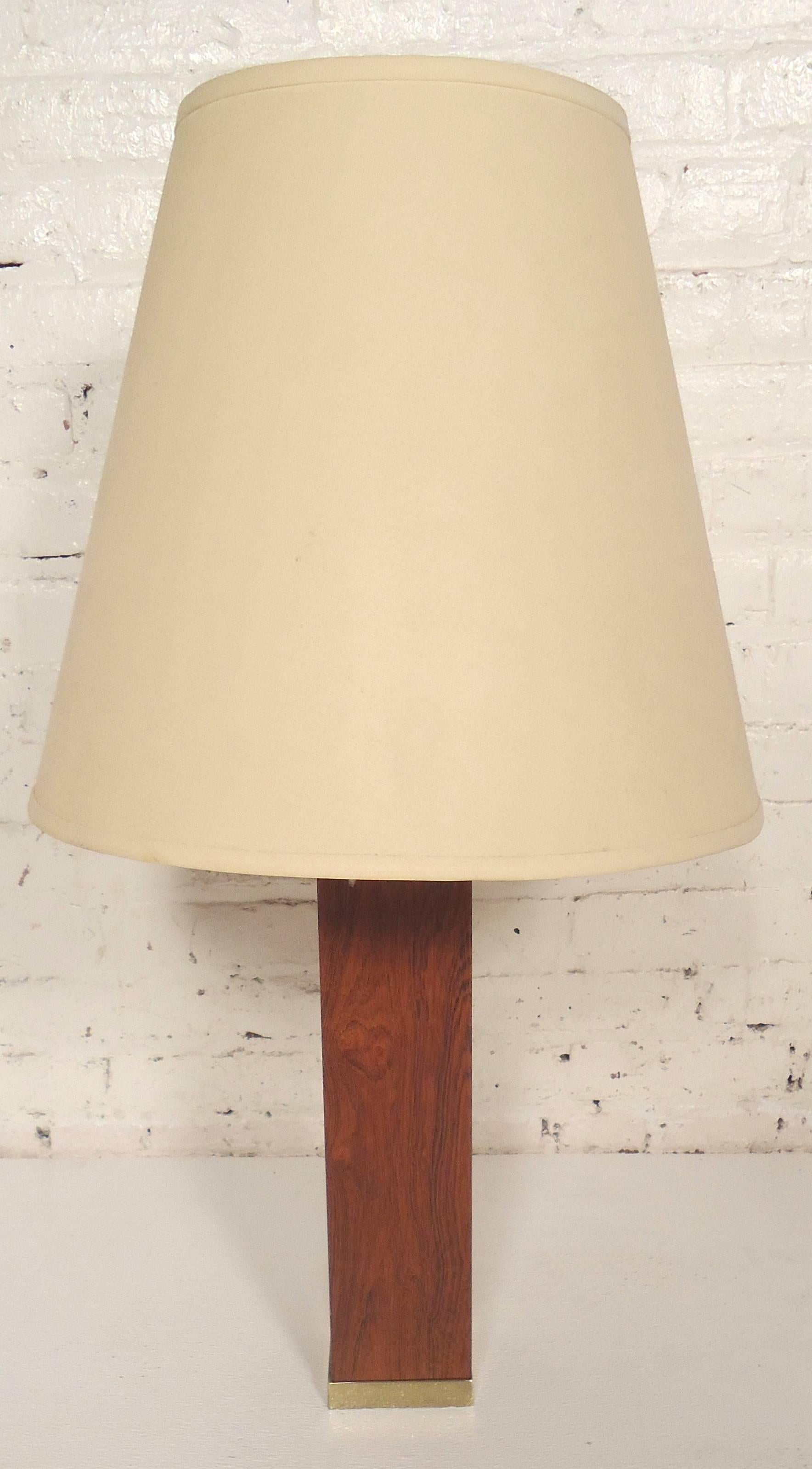 Simple and elegant wood table lamp with brass base. Square lamp with warm teak grain.

(Please confirm item location - NY or NJ - with dealer).
  