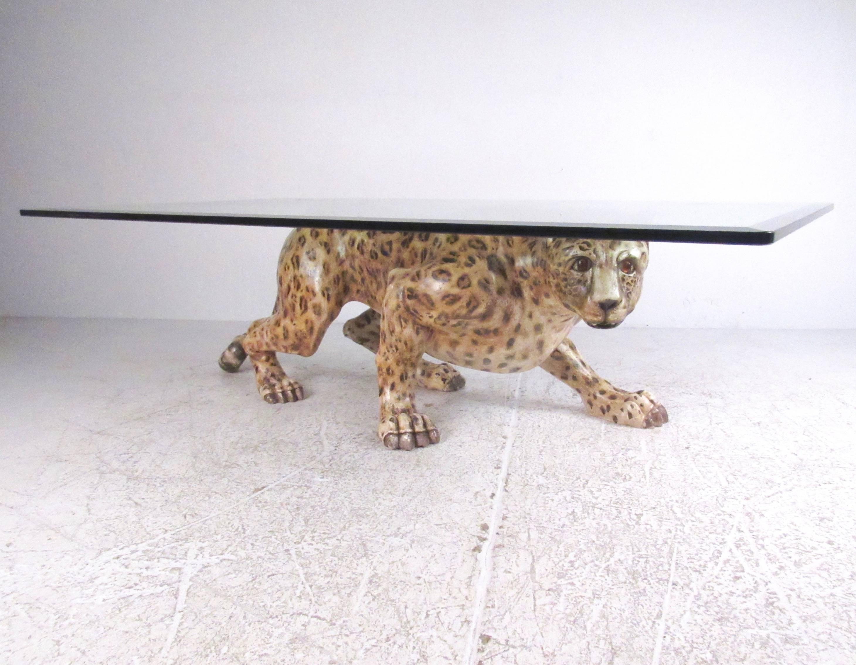 This unique vintage coffee table features wood-carved representation of a life-like leopard. Carefully painted base is paired with large bevelled glass top, making an impressive and memorable addition to any luxury interior. Please confirm item