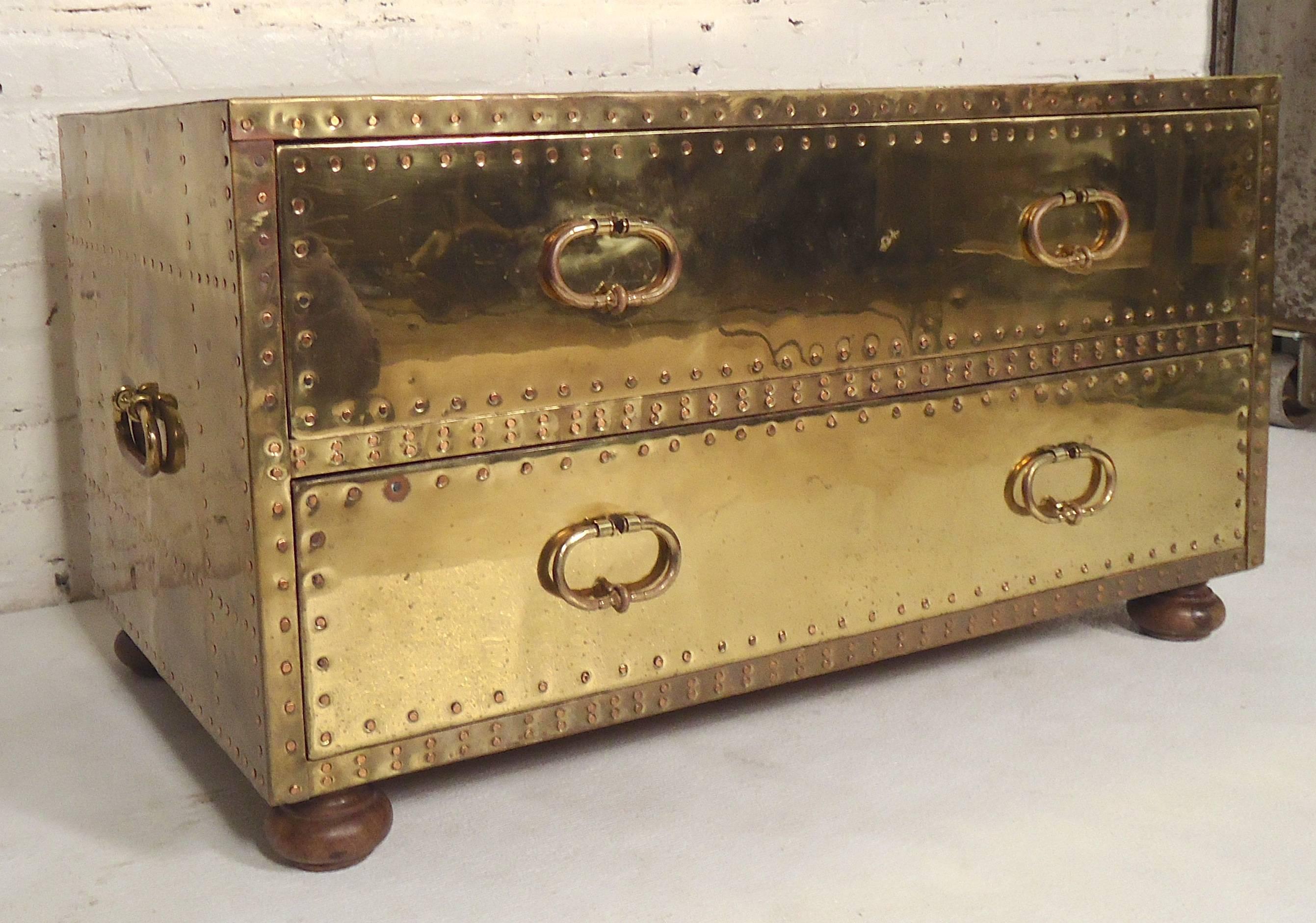 Handsome chest of drawers with brass plate Campaign finish. Wooden club feet, large brass handles, and exposed nailhead trim.

(Please confirm item location, NY or NJ, with dealer).
 