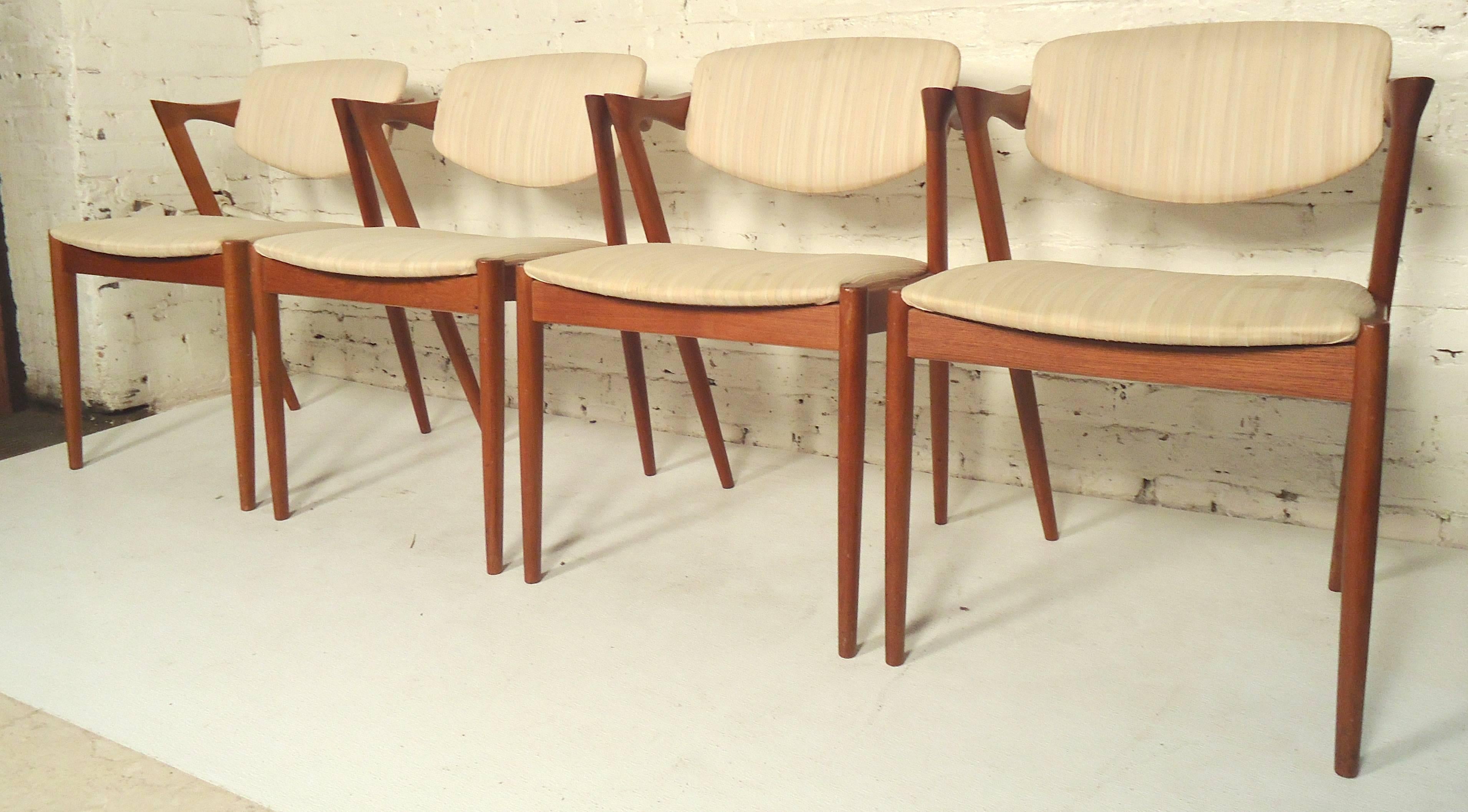 Set of four Classic Danish modern dining chairs by Kai Kristiansen. Great form with solid teak frame and cushioned seat and back.

(Please confirm item location - NY or NJ - with dealer).
 