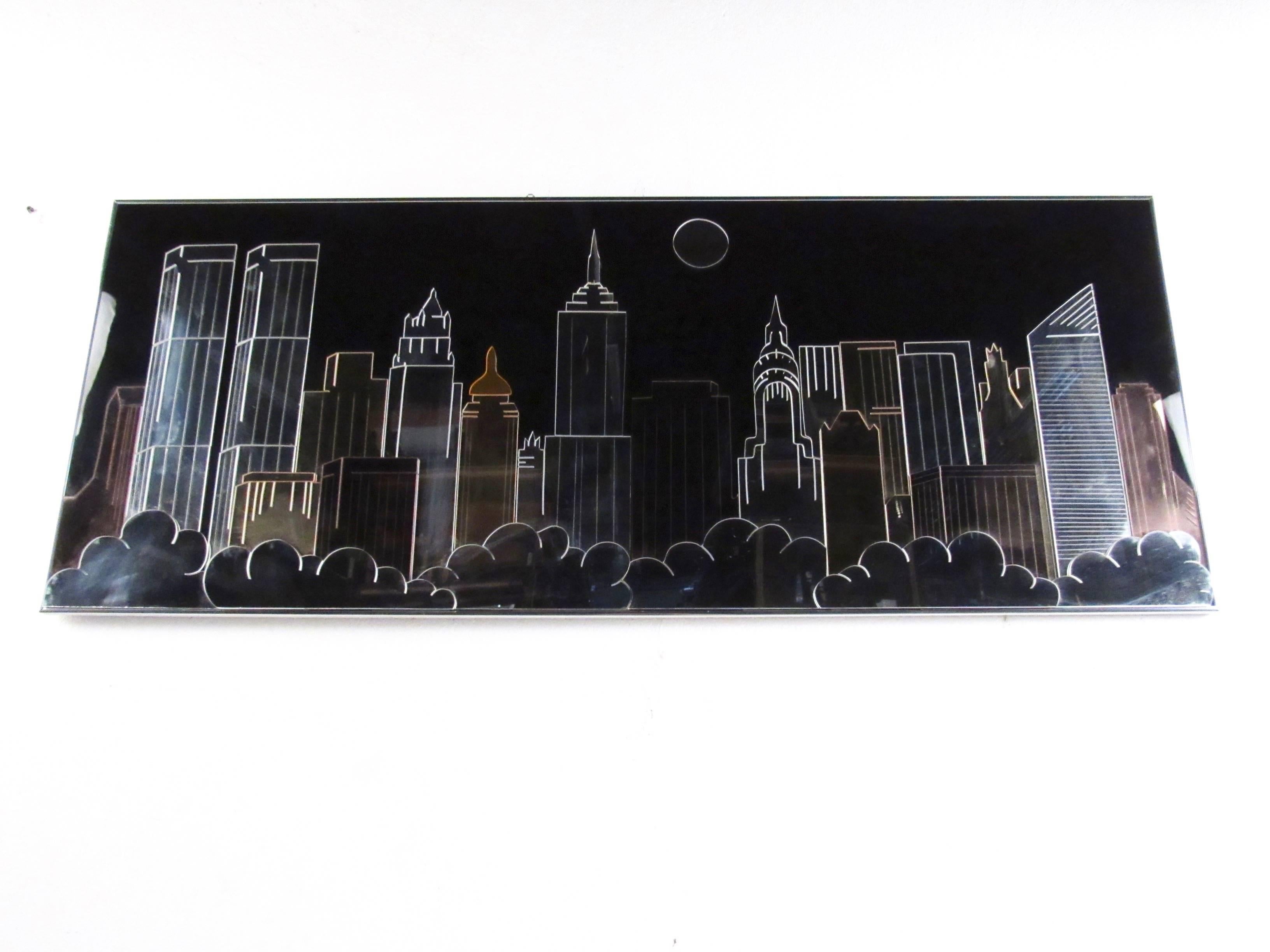 This stylish vintage modern wall art features mixed metal, acrylic, and mirror to create a New York City skyline effect with twin towers, Empire state building, and more. Contemporary modern decorator feel makes an interesting, 1980s style wall