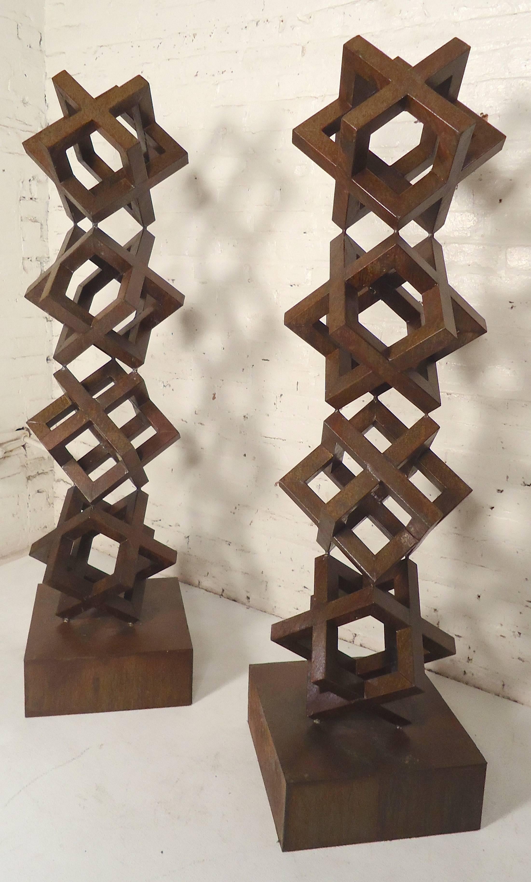 Fantastic sculptures with stacked cubes. They have beautiful oxidation throughout, and would look great indoor or outdoor.


       