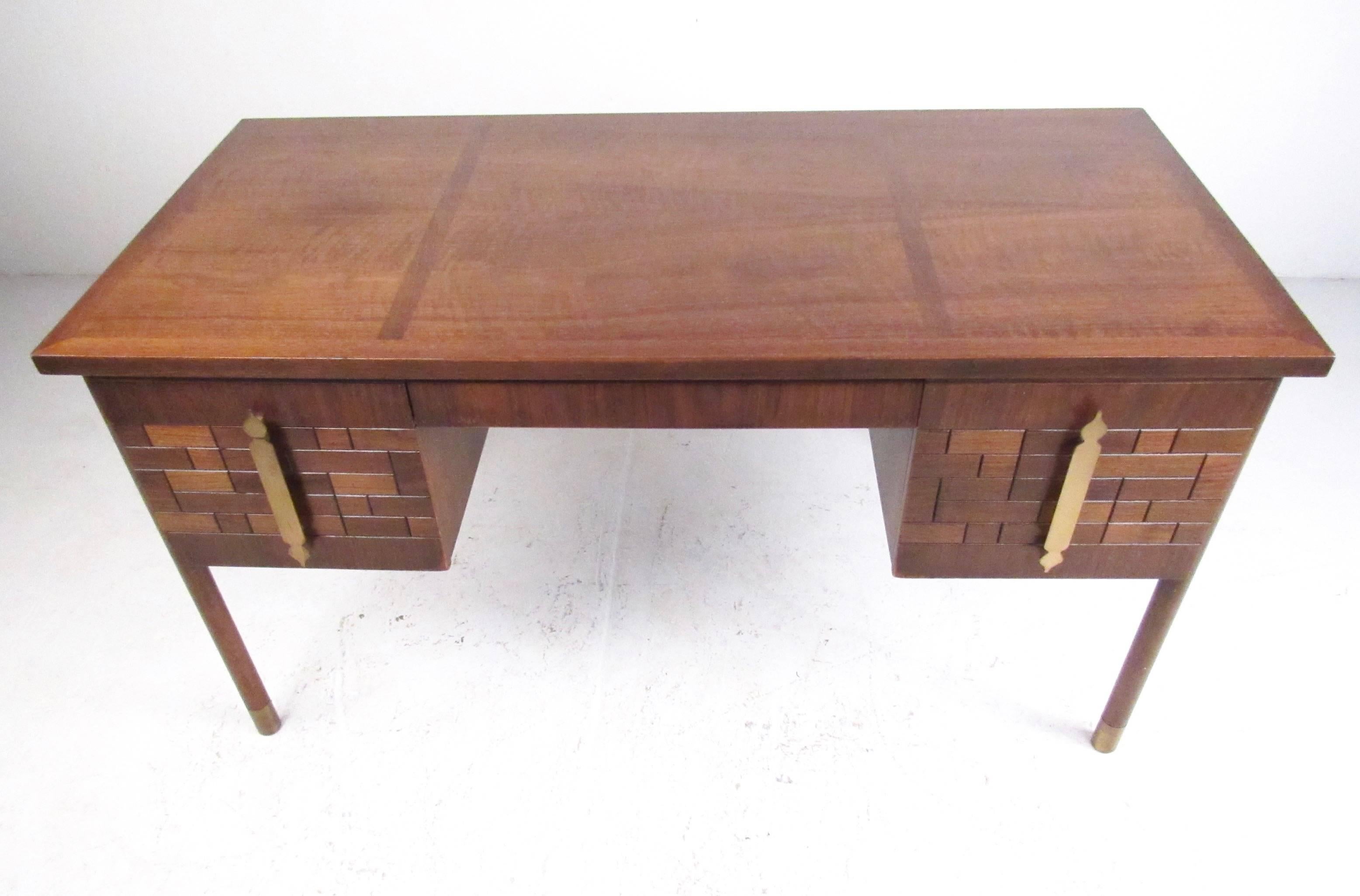 This stylish vintage walnut desk by Bert England for Johnson Brothers feature sculptural walnut fronts with unique parquetry finish. Impressive brass handles showcase the iconic midcentury design of the Bert England Trend Collection. Please confirm