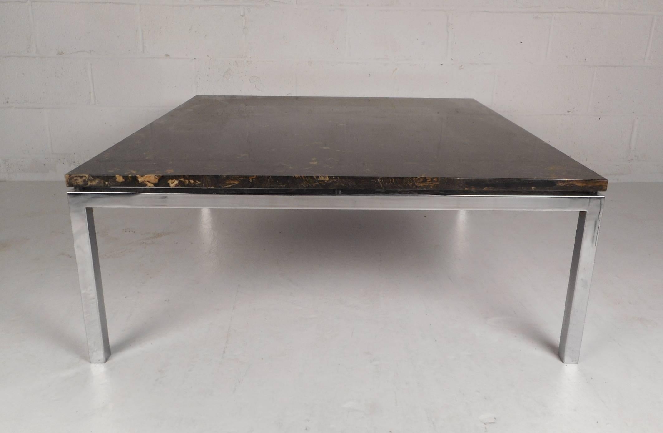 This gorgeous vintage modern coffee table features a square marble top and a heavy chrome frame. This elegant vintage modern cocktail table makes the perfect addition to any home, business, or office. Please confirm item location (NY or NJ).