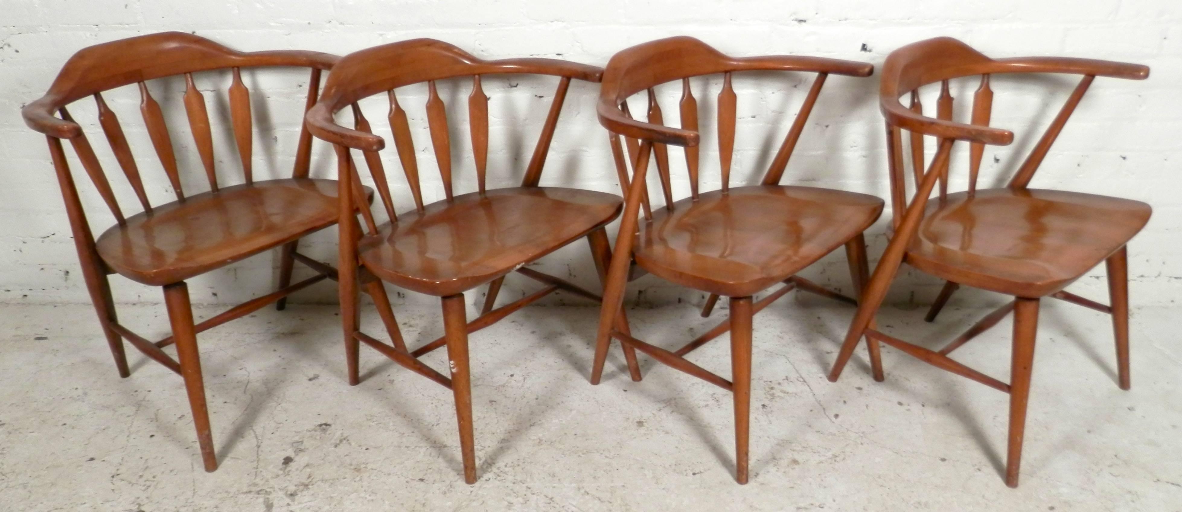 Four vintage round back ding chairs with slat backs. Comfortable shovel seats, tapered legs and slanting back legs. 

(Please confirm item location, NY or NJ, with dealer)
 