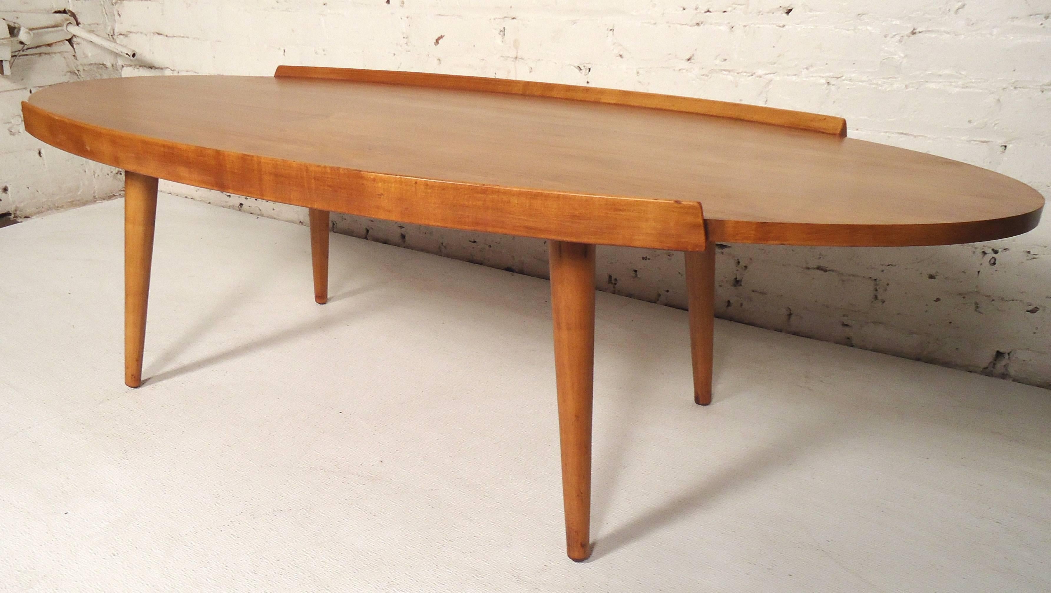 Vintage modern maple table with trim and tapered legs. Great shape, and newly refinished.

(Please confirm item location - NY or NJ - with dealer).
 