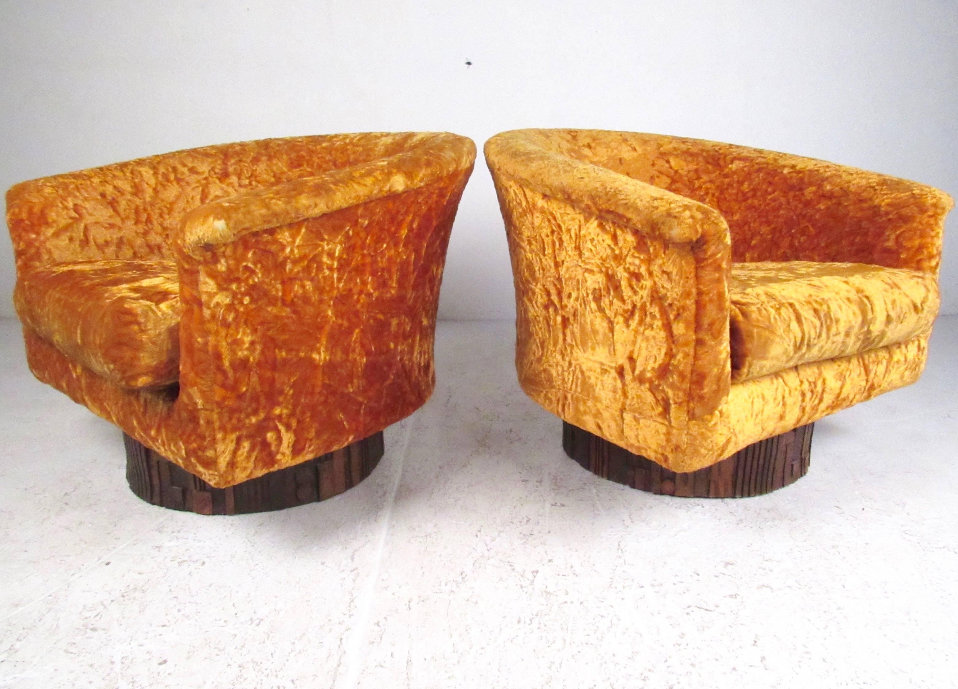 This stylish pair of vintage modern club chairs by Adrian Pearsall design for Craft Associates make a unique addition to home or business seating. Sculptural hardwood bases feature full rotation swivel and comfortable rocking motion, while the