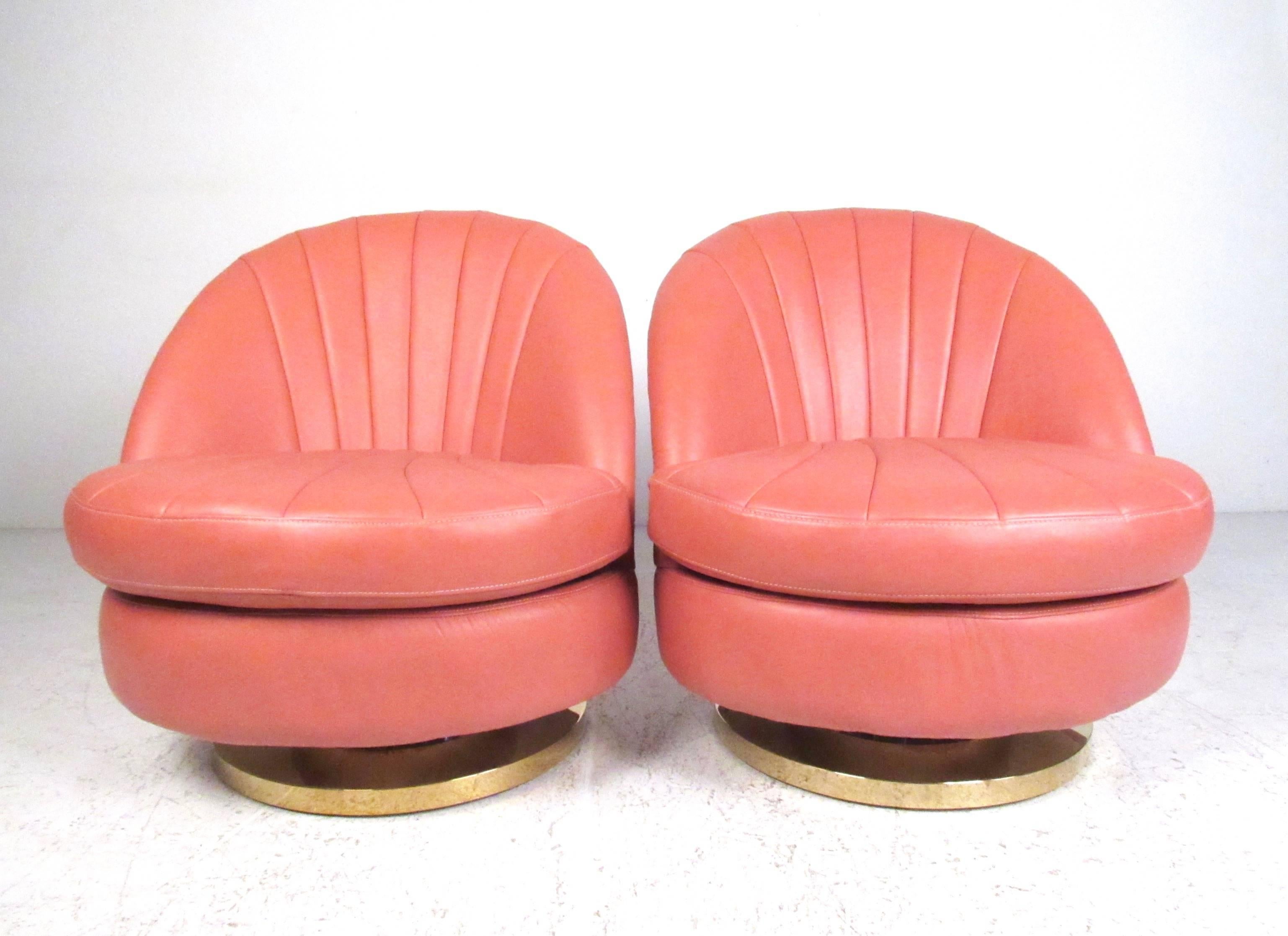 This unique pair of contemporary modern club chairs feature smooth swivel function with shell style seat backs. The comfortable pair of well-made leather lounge chairs make this impressive pair the perfect seating addition to home or business.