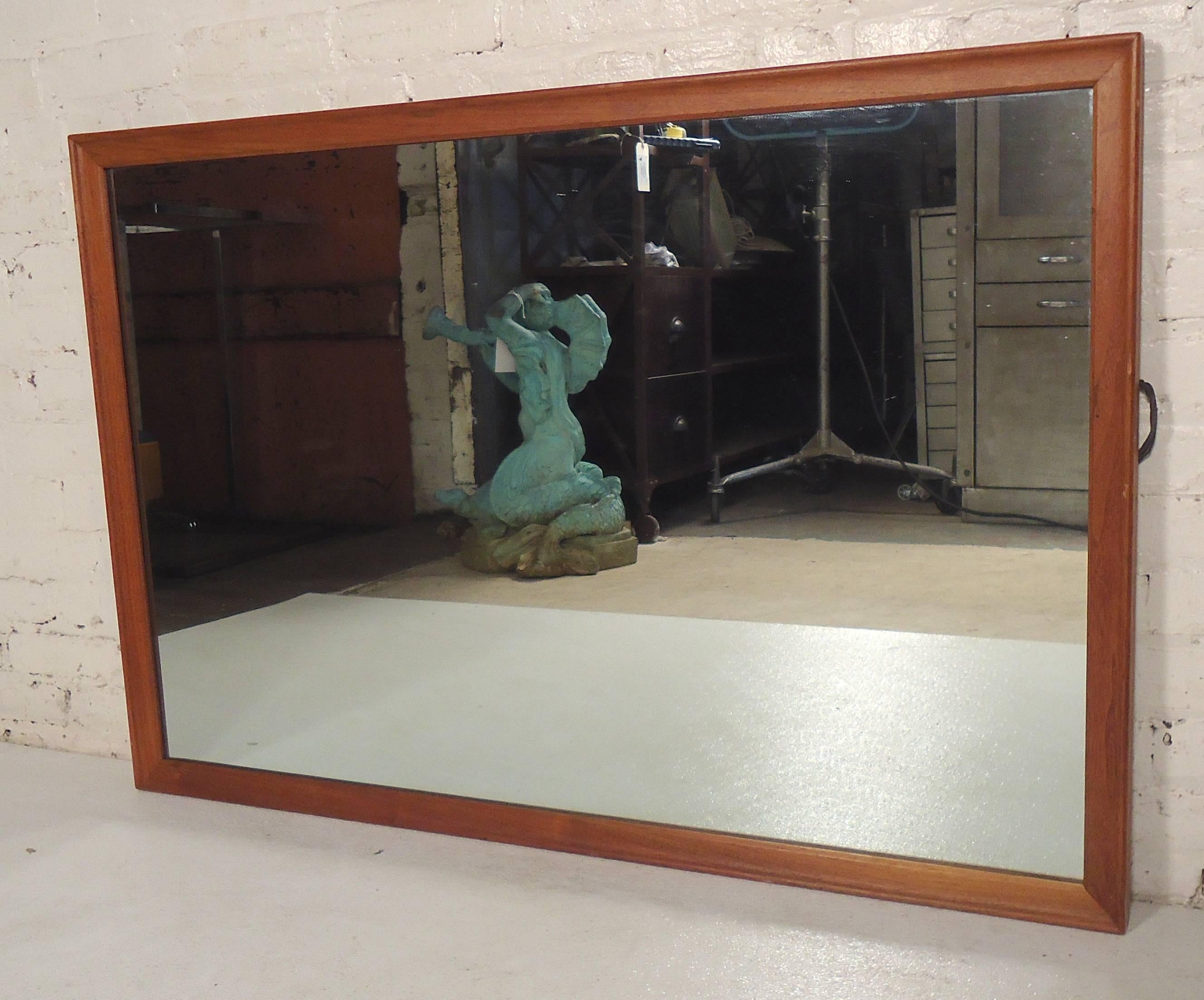 Vintage wall mirror with teak frame. Simple and modern design. Can be hung horizontal or vertical.

(Please confirm item location - NY or NJ - with dealer).
     
