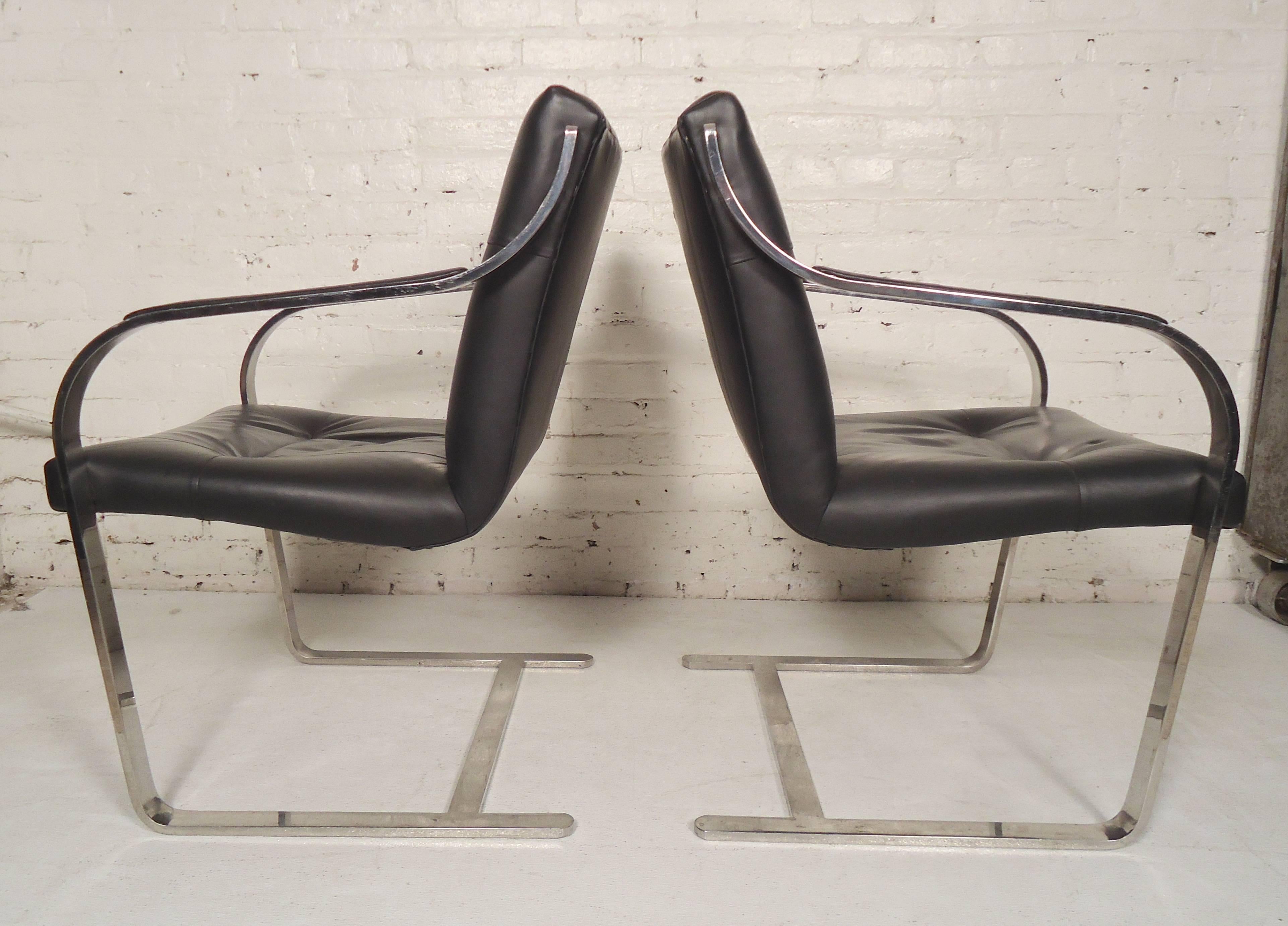 Pair of polished chrome chairs with cantilever base. Made by Brueton, featuring handsome lines and comfortable cushioned seat and back.

(Please confirm item location - NY or NJ - with dealer).
 
