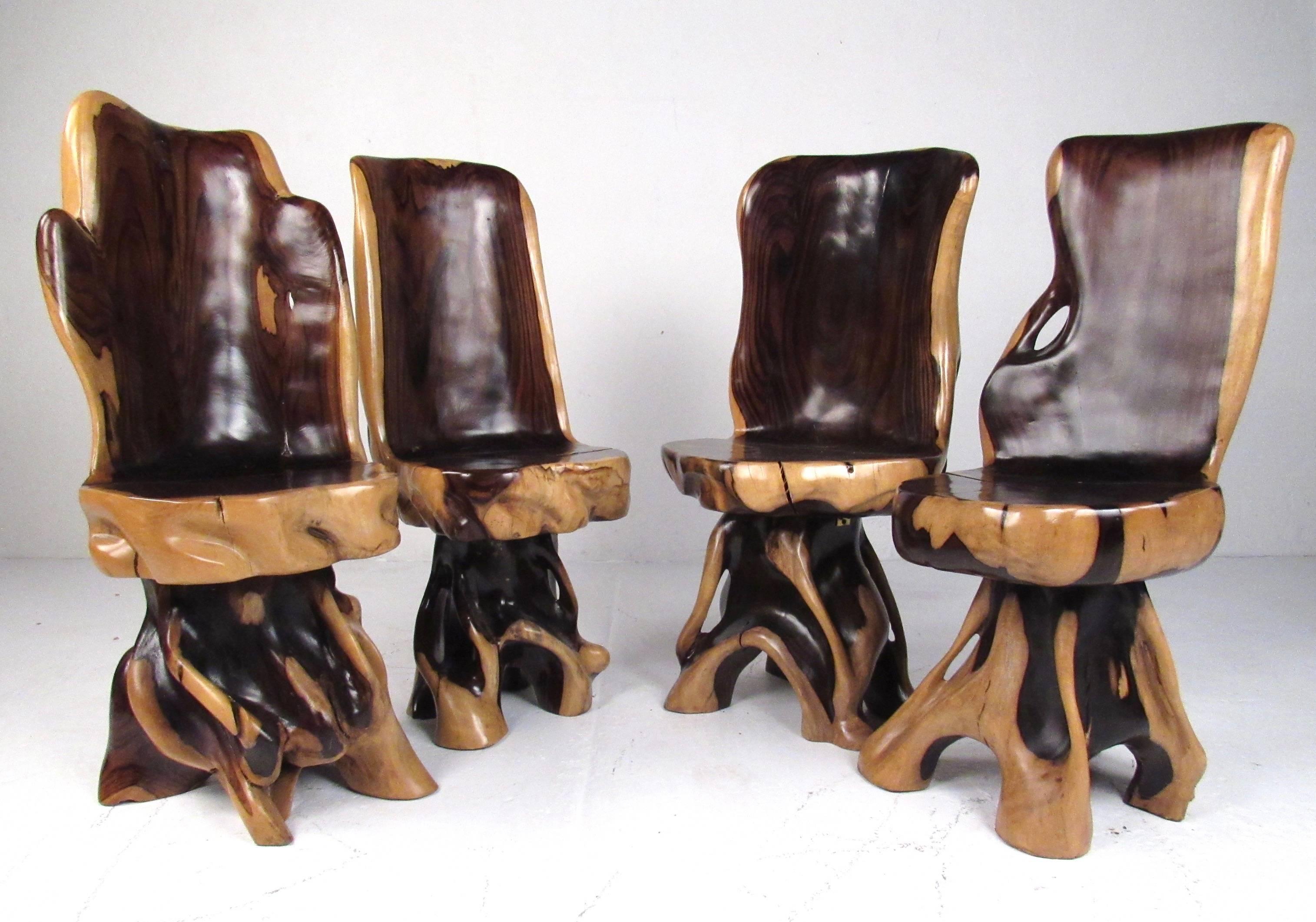 This exquisite matched set includes a stunning game table with four matching chairs. The natural root formation of the wood is accentuated by detailed artisan sculpting, while the two tone finish makes a striking addition to home or business