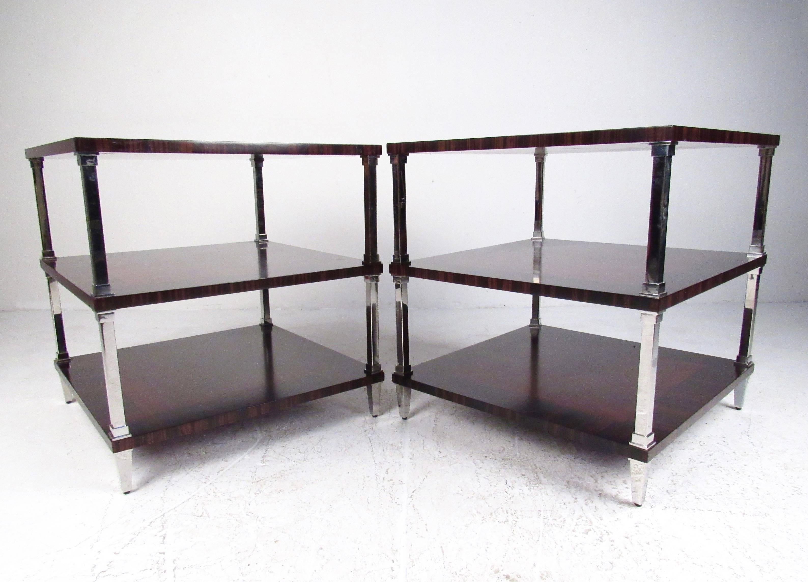 This unique pair of two-tier end tables feature heavy construction and shapely chrome finish legs add to the modern appeal of the pair. Rosewood finish bands the top surface, impressive addition to any home or business interior. Please confirm item
