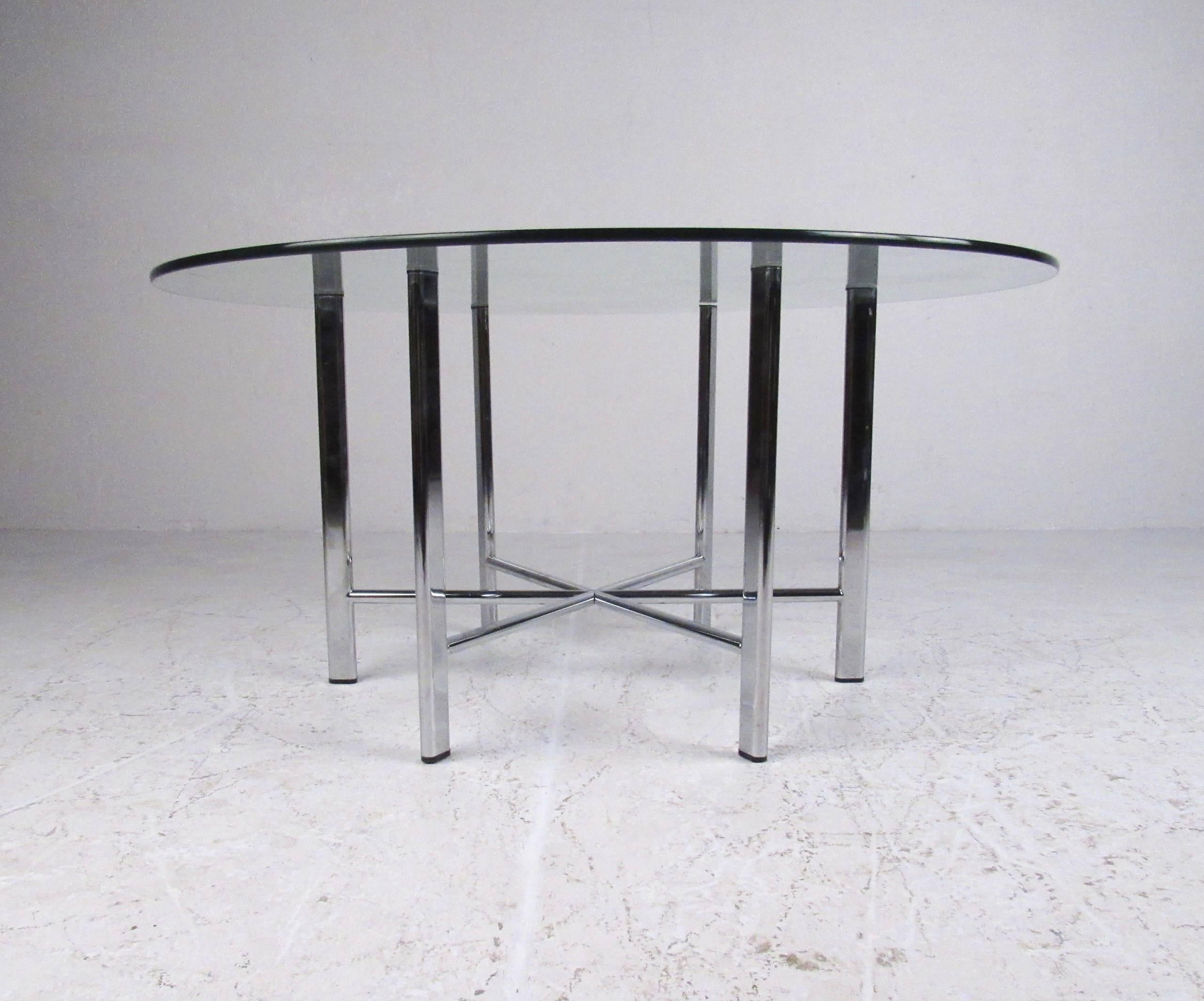 This stylish contemporary modern coffee table features sturdy chrome base with circular glass top. Sleek and simple coffee table for home or business seating area. Please confirm item location (NY or NJ).