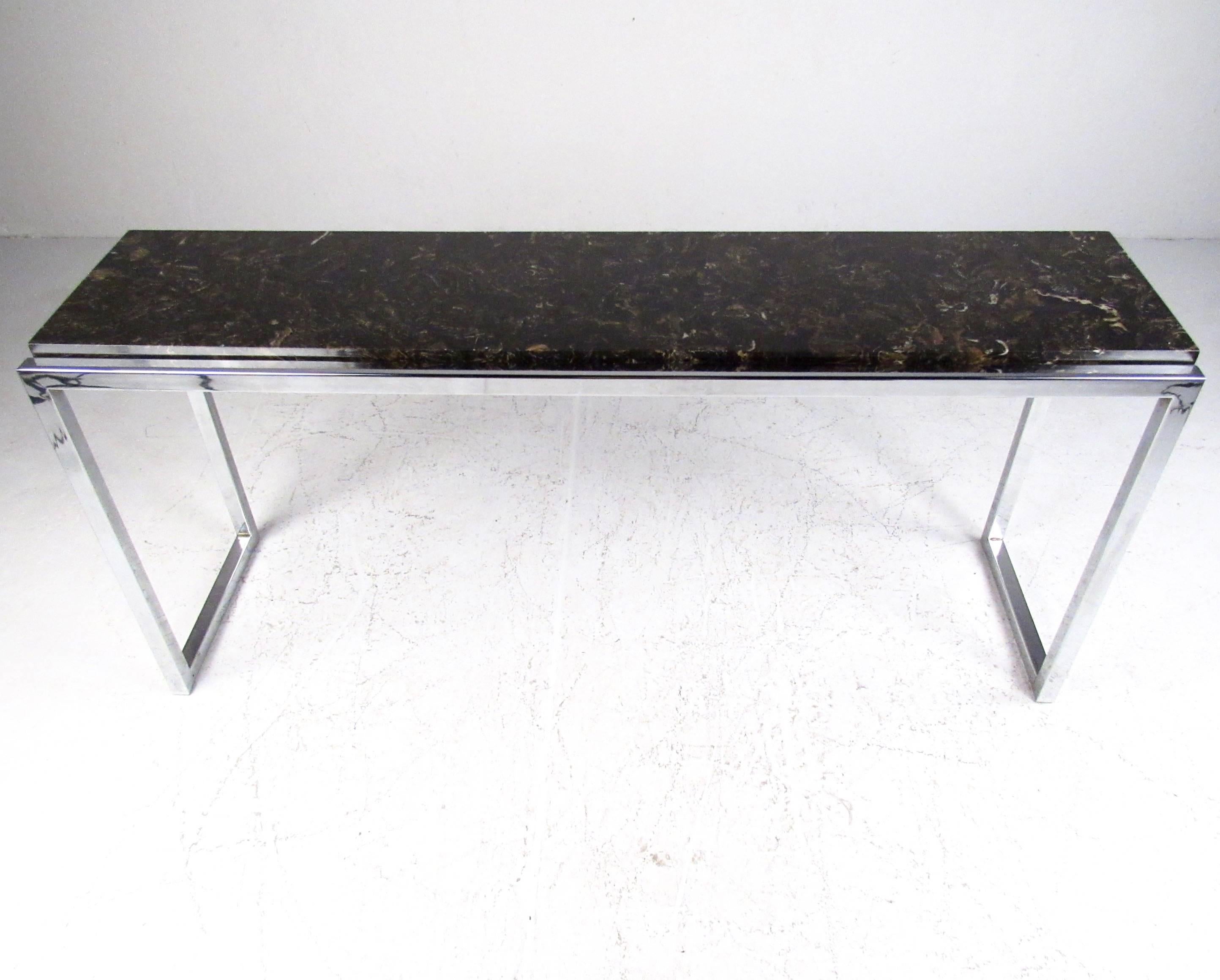 This stylish modern console table features a marble slab top and chrome base. Sleek and stylish sofa table makes an elegant modern addition to any home or business setting. Please confirm item location (NY or NJ).