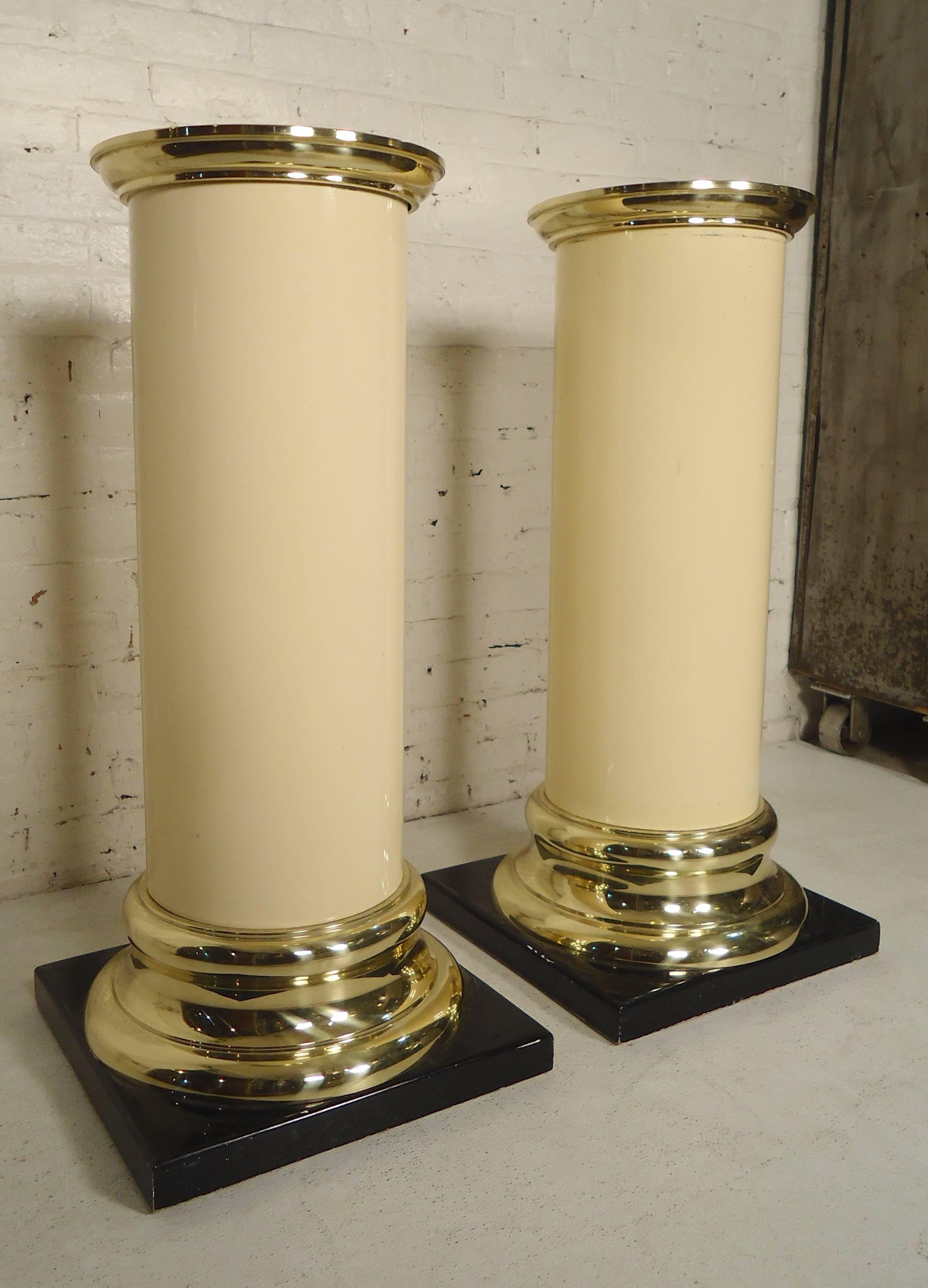 Round plastic off white pillars with brass color tops and bases set on black stands. Tagged underneath with the Trump Plaza Casino tag.

(Please confirm item location - NY or NJ - with dealer).
 