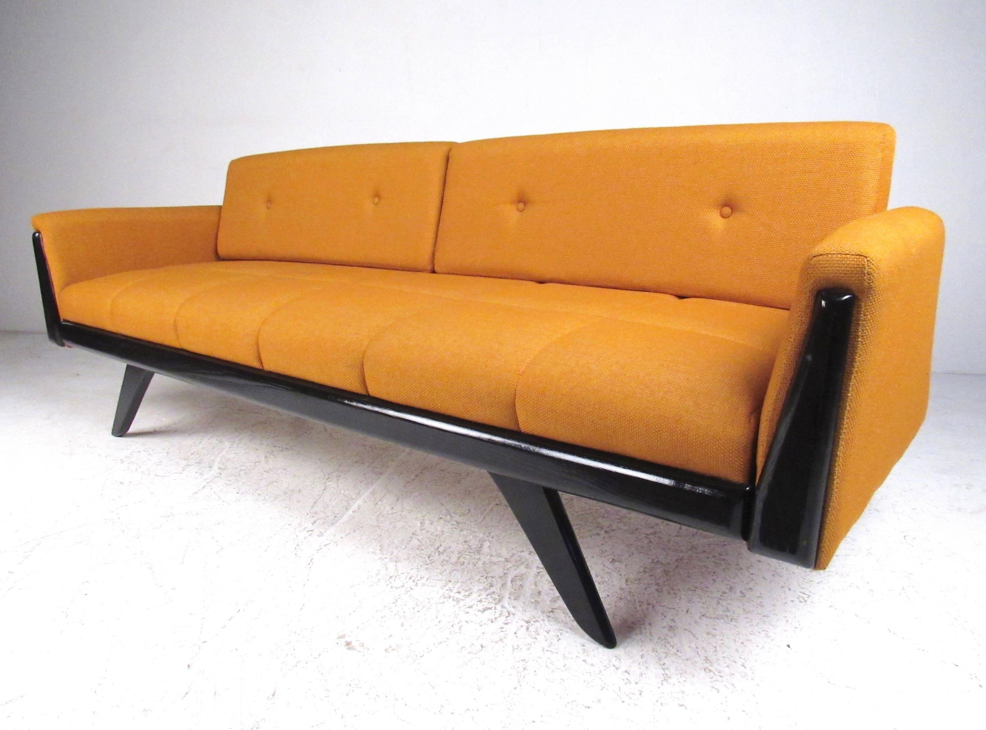 This gorgeous vintage sofa features Pearsall style frame, tapered legs, and tufted orange fabric. Wonderful mix of mid-century atomic design and tieless comfort. Please confirm item location (NY or NJ).