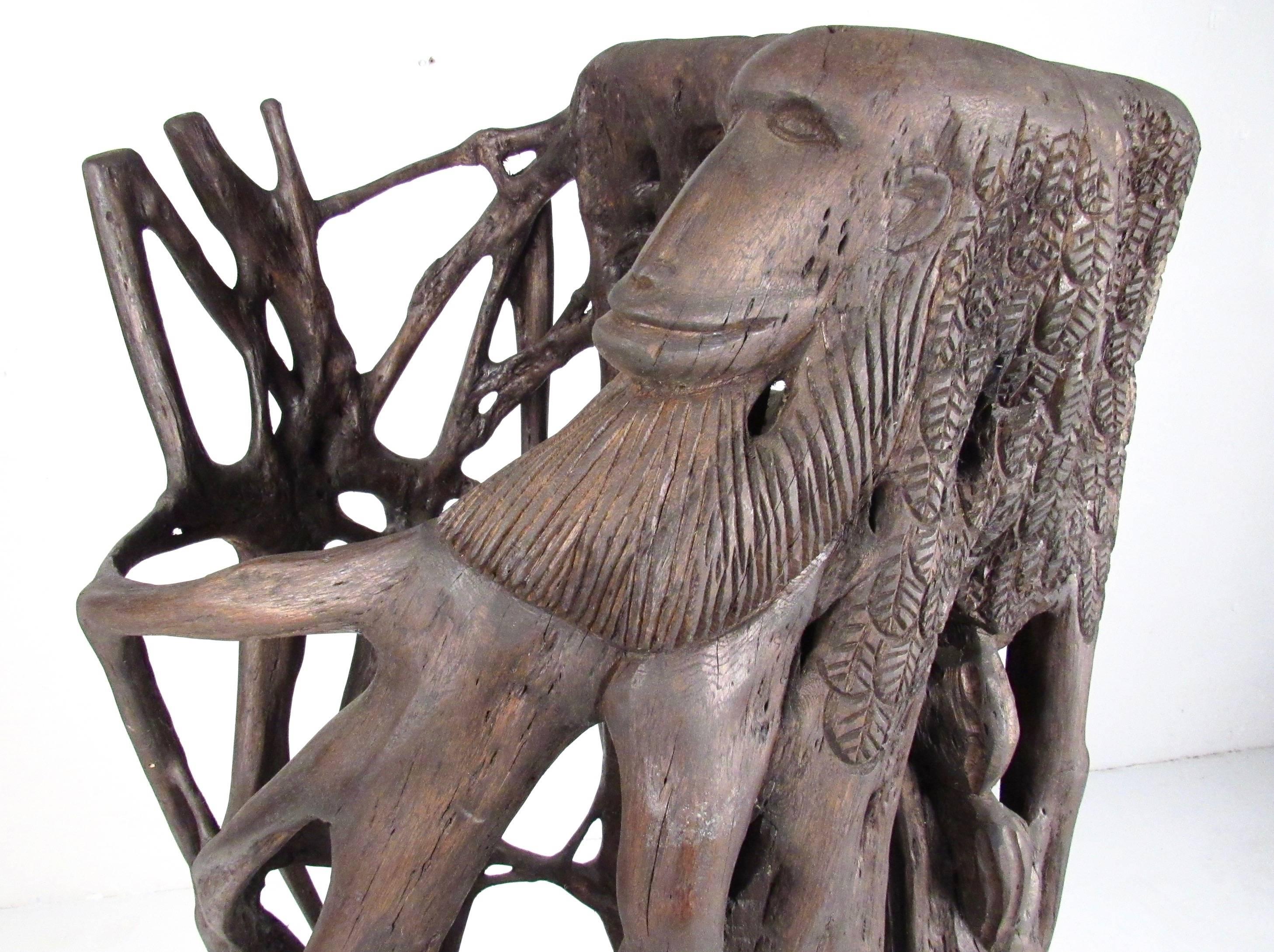 This impressive large-scale sculpture stands over five feet tall and features natural tree trunk/root elements combined with artistic hand-carved design including animal and abstract details. Mounted on plywood base with decorative finish. This