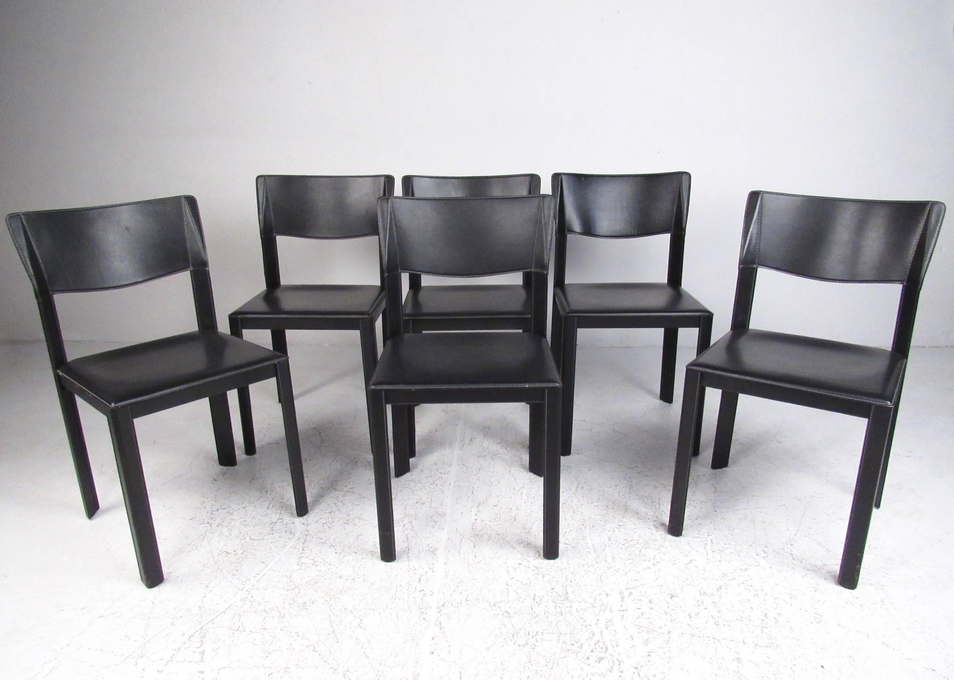 This stylish set of contemporary modern dining chairs feature leather upholstery with stitched edge trim. Sleek Italian design is the perfect mix of comfort and style, perfect dining room chairs. Please confirm item location (NY or NJ).