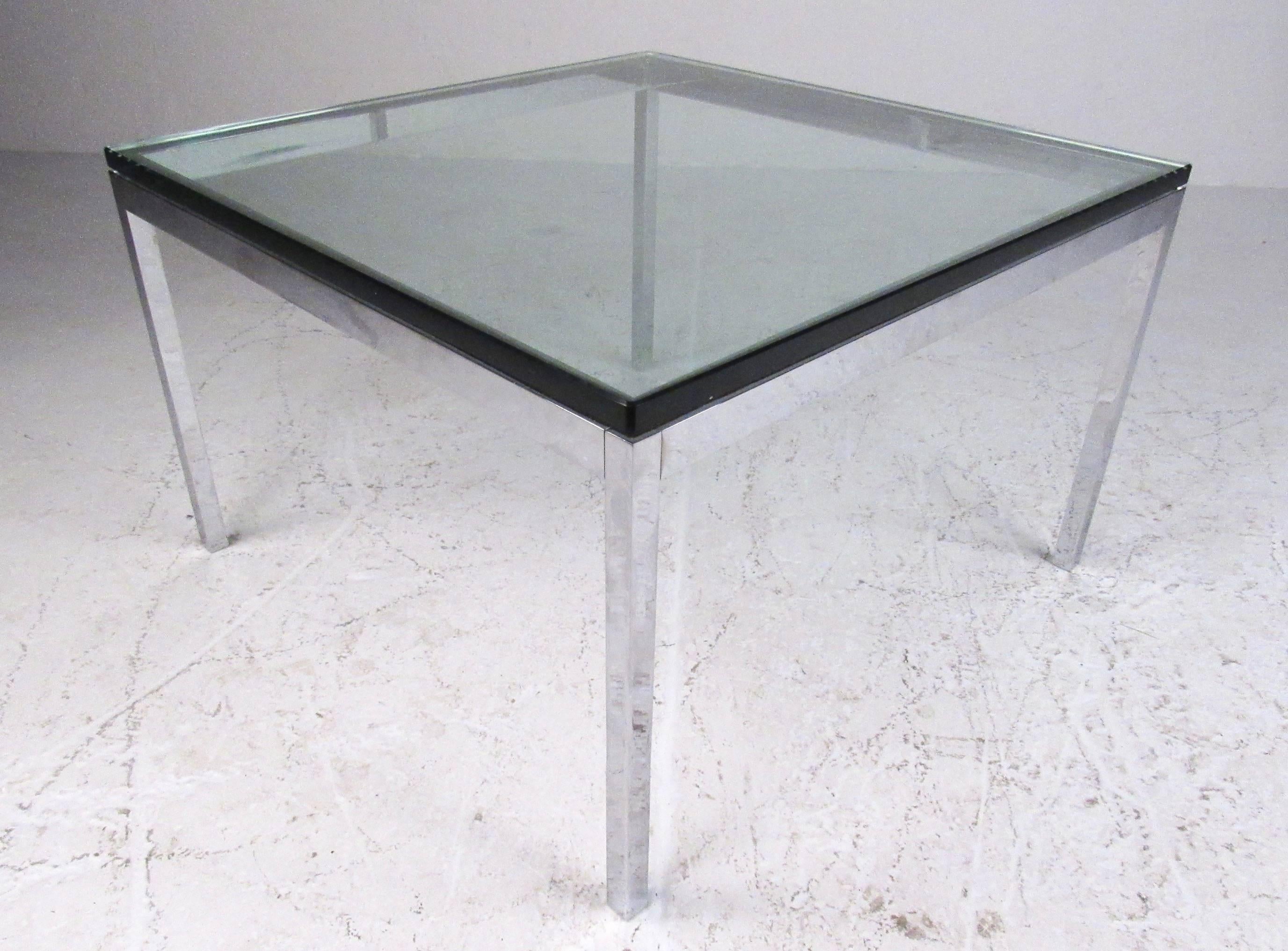 This stylish pair of vintage modern tables feature chrome and beveled glass construction, perfectly complimenting the mid-century design. Well suited as matching coffee tables or lamp tables. Please confirm item location (NY or NJ). 