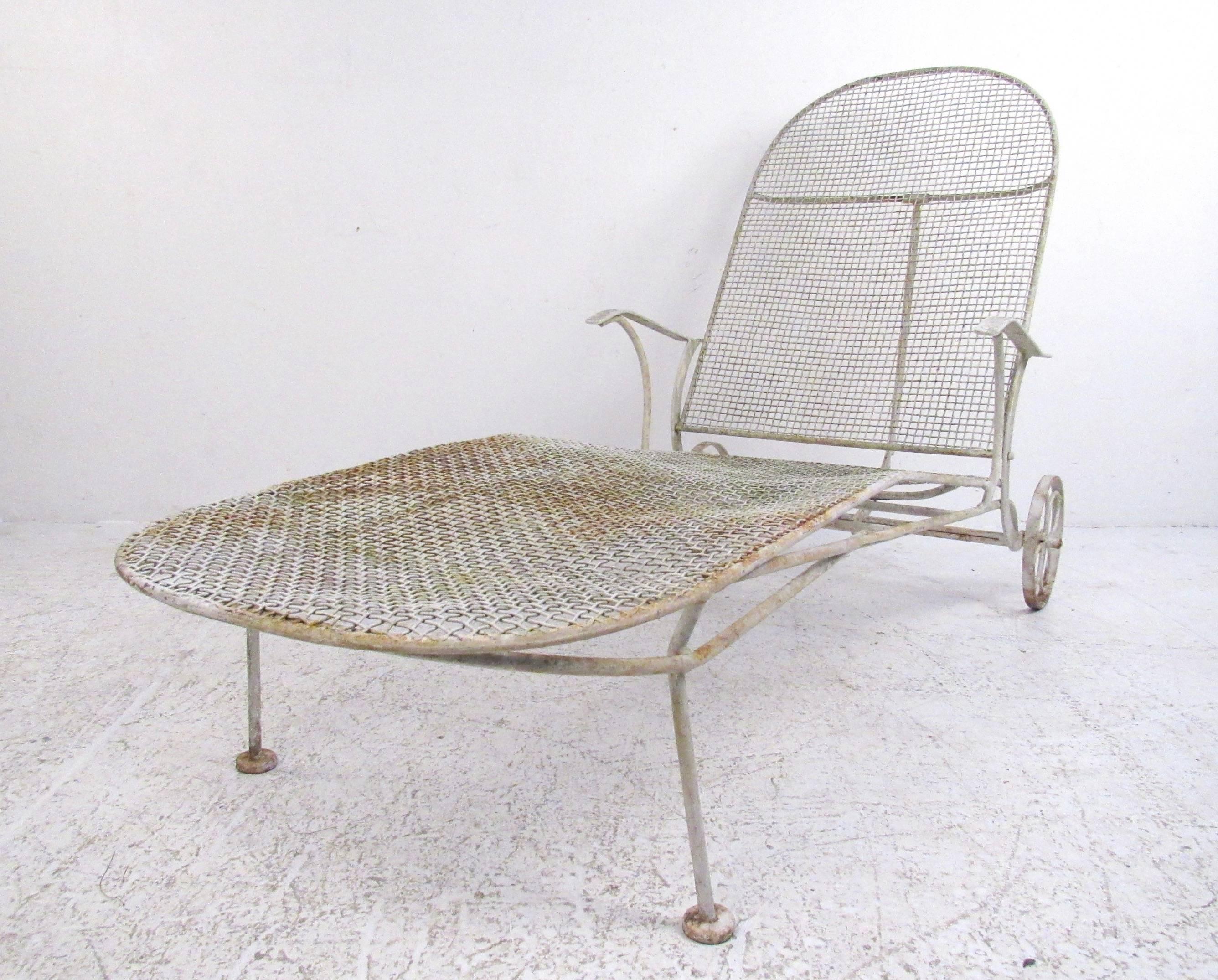 This stylish mid-century patio lounge chair features the vintage design of Russell Woodard's Sculptura line of patio furniture. Iron construction pool lounge adjusts seat tilt from upright to flat, opening from 60deep to 77 inches deep. Shapely