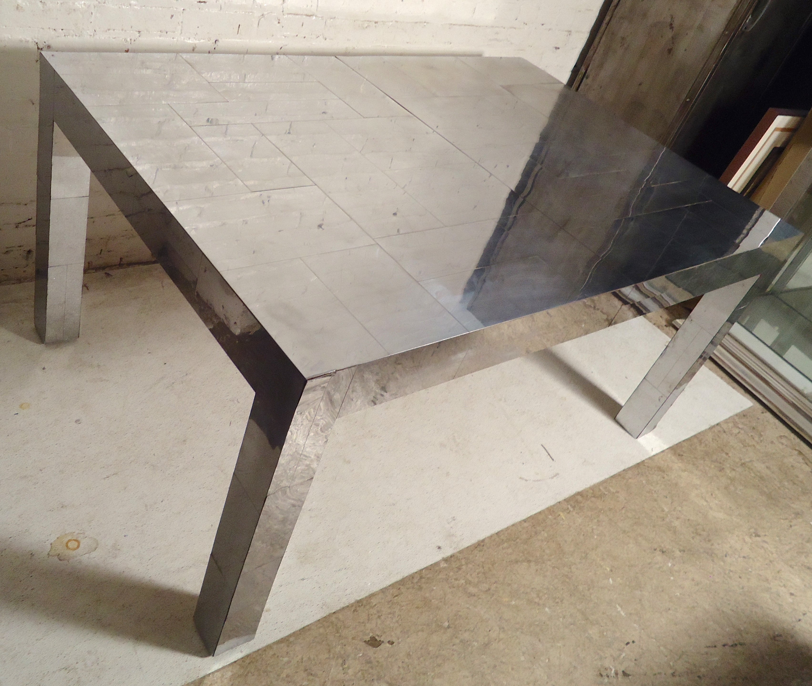 Polished chrome patchwork table by Paul Evans for his Cityscape line. Comes with a 15