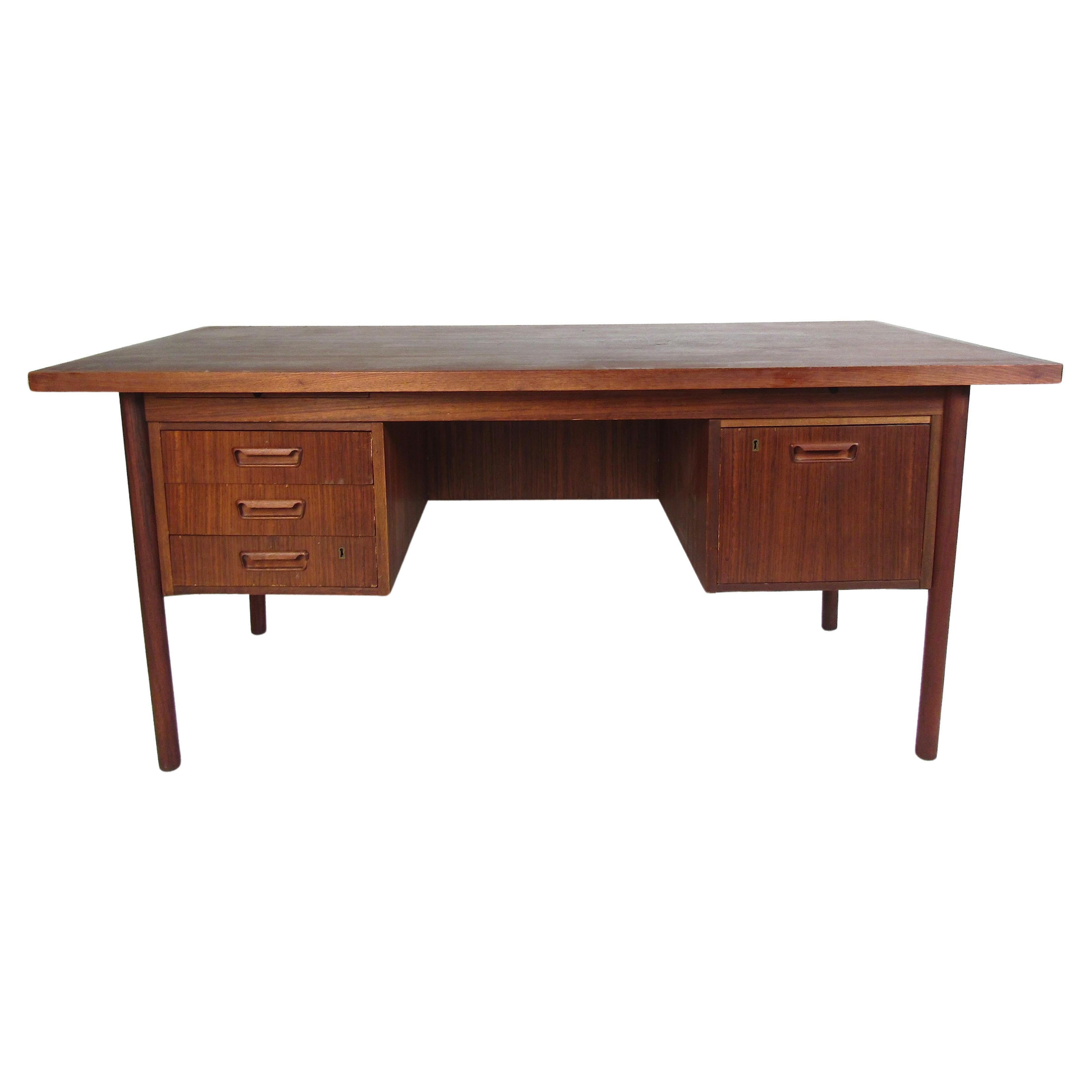 Midcentury Teak Desk with a Finished Back For Sale