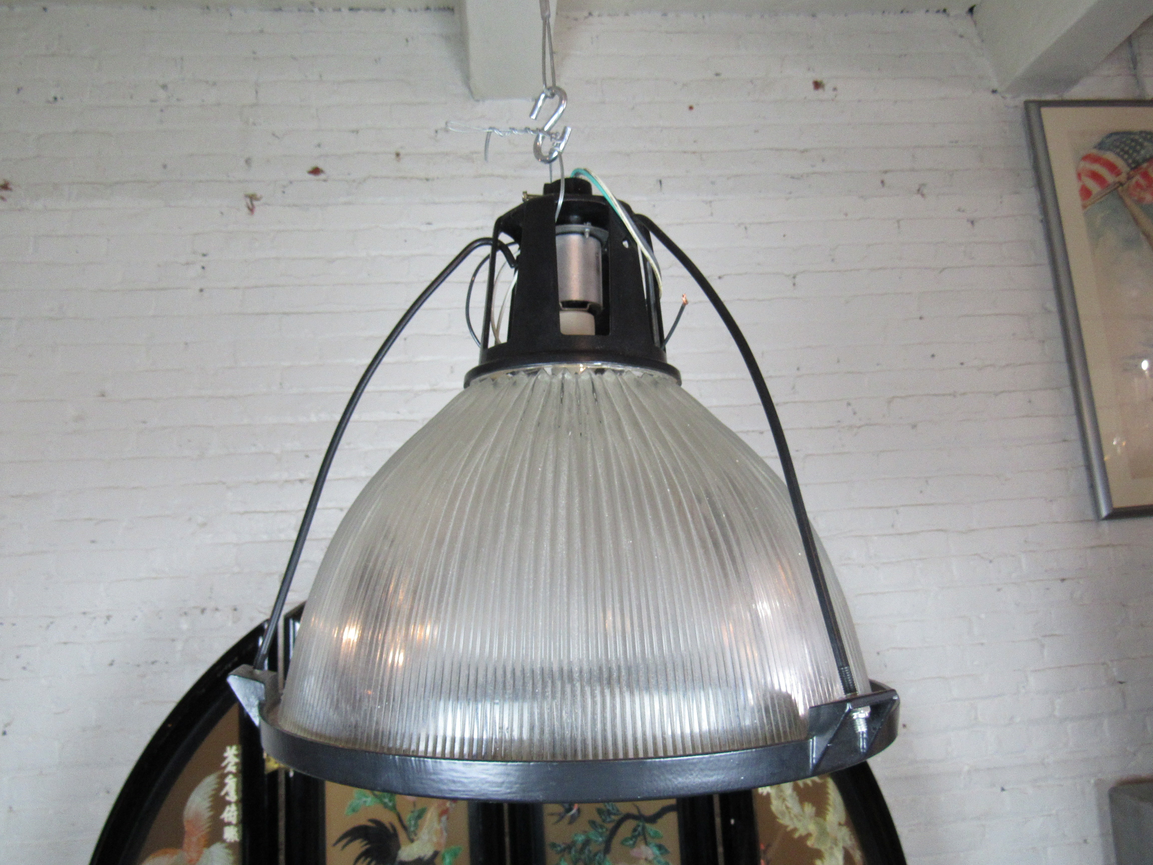 A heavy-duty industrial hanging lamp perfect for any shop or workspace. 
Please confirm item location with seller (NY/NJ).