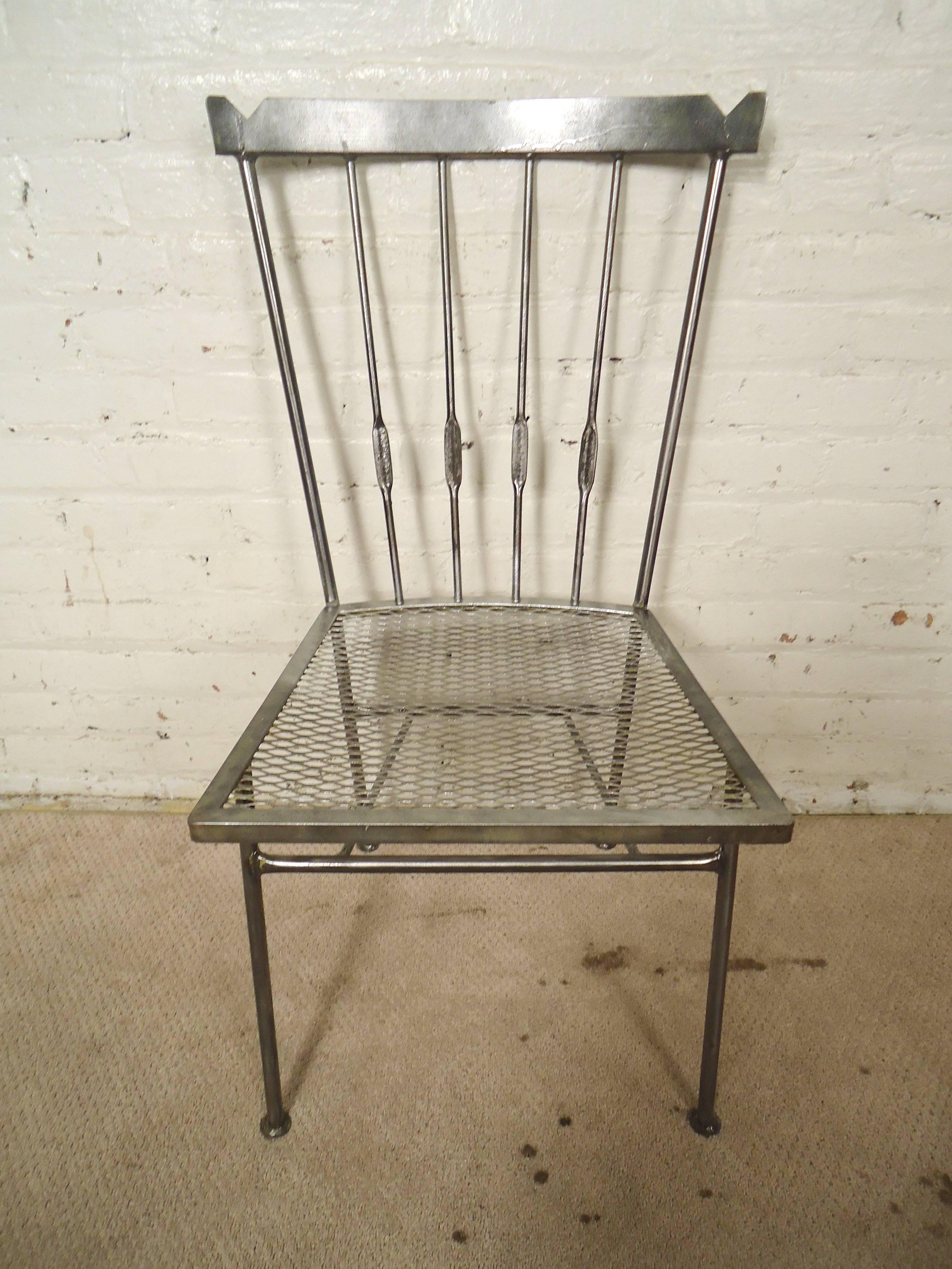 Set of four unique chairs with mesh seats and tall spindle backs. Refinished in a handsome bare metal style. Great for a modern dining room or covered patio.

(Please confirm item location - NY or NJ - with dealer)