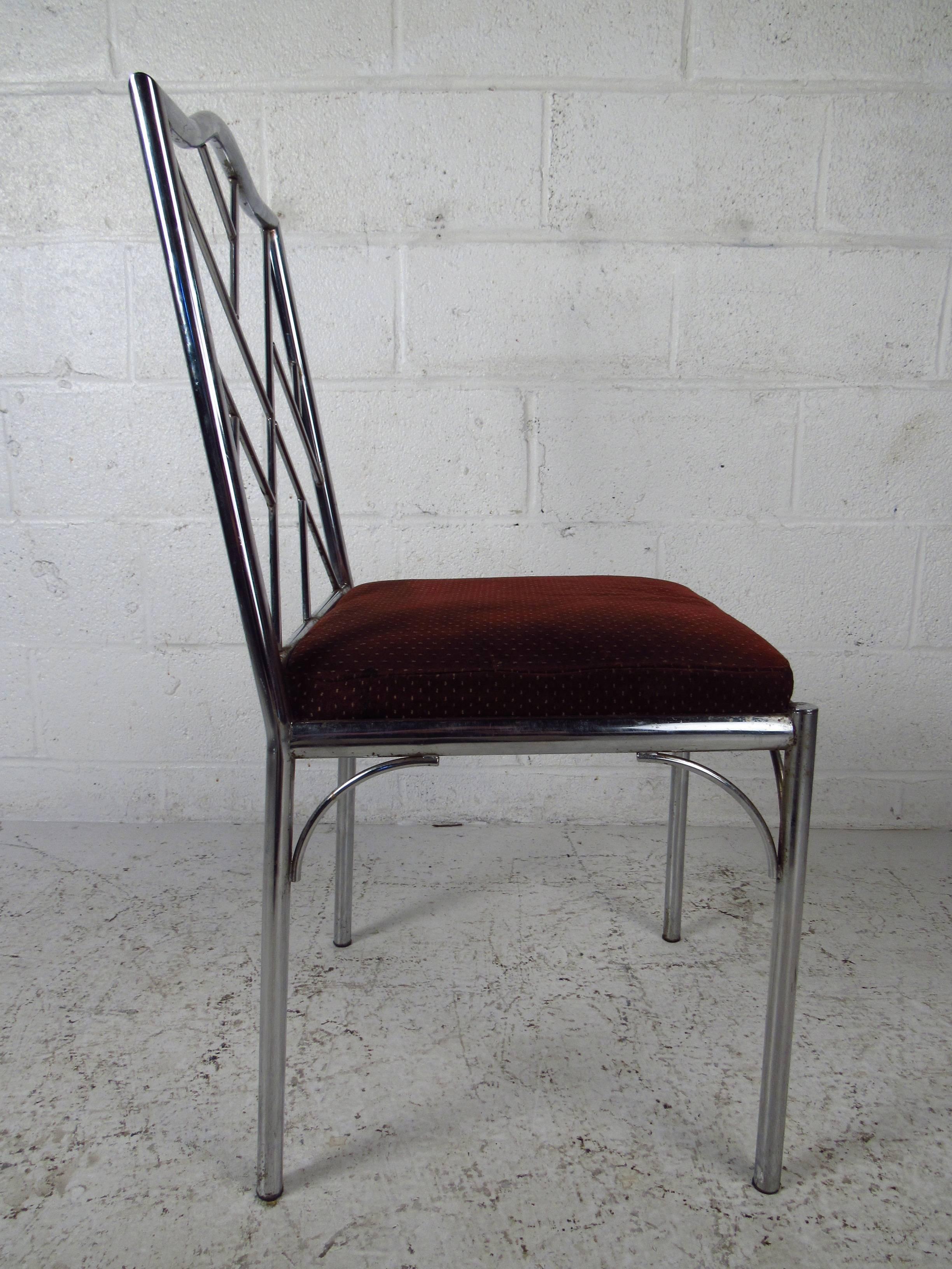 Four vintage-modern chrome dining chairs, features sculpted seat back and base and upholstered seats. Stylish set makes a comfortable and striking addition to kitchen or dining room seating.

Please confirm item location NY or NJ with dealer.