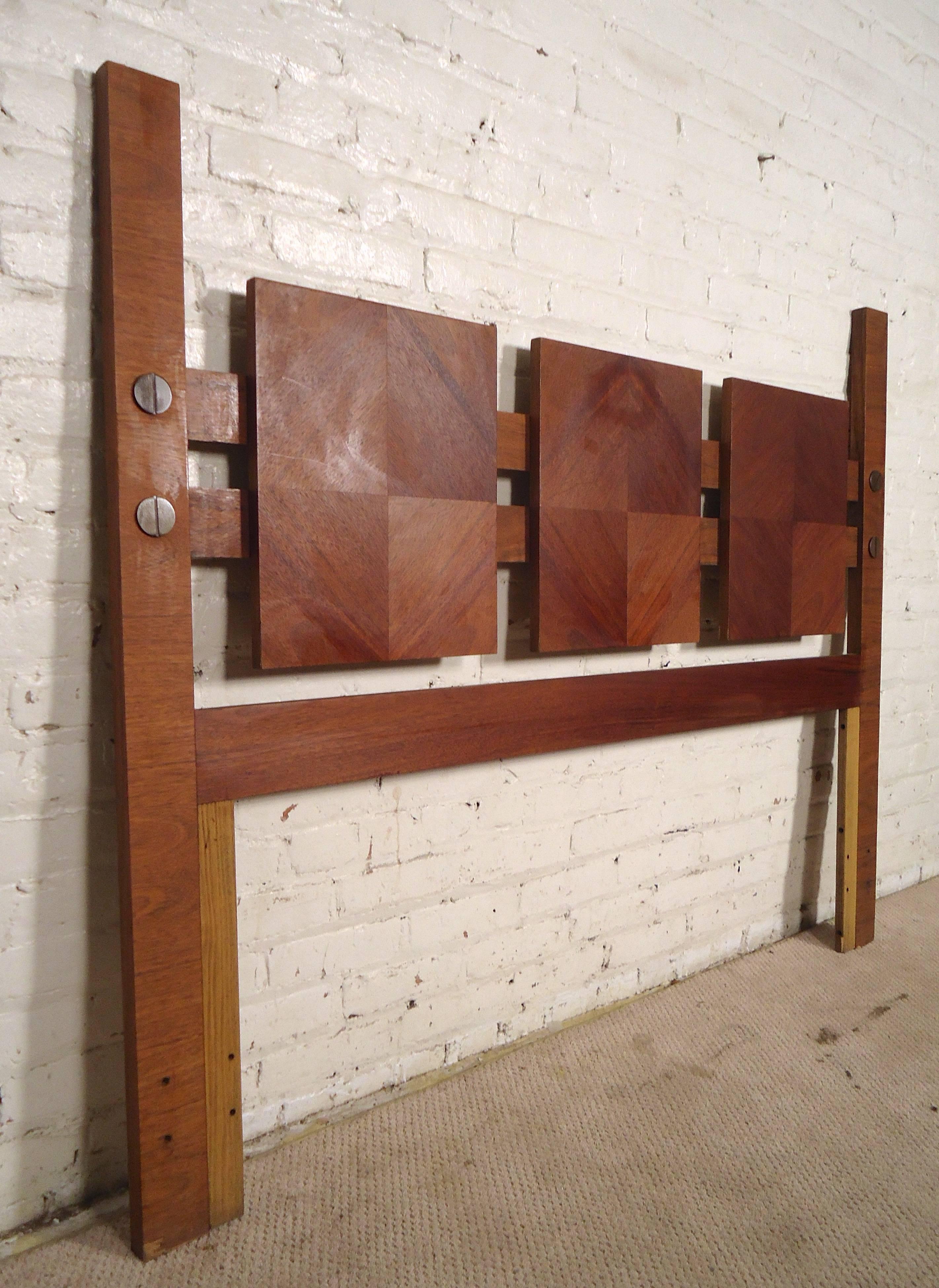 Queen size headboard featuring diamond shape walnut grain panels and large exposed brass screw heads.

(Please confirm item location - NY or NJ - with dealer)