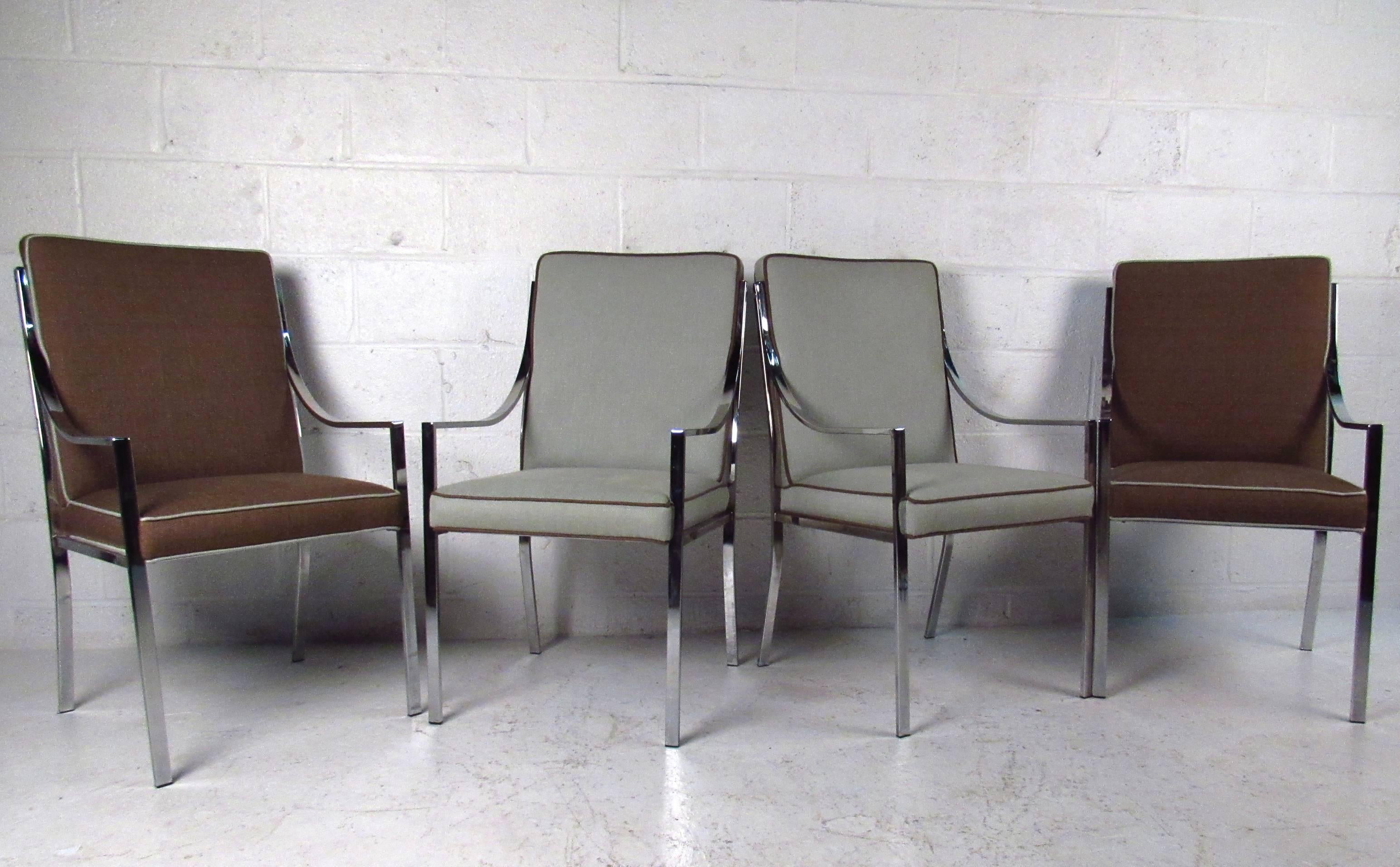 This beautiful set of chrome frame dining chairs features comfortable two-tone upholstery, unique low profile armrests, and fantastic Mid-Century style. Please confirm item location (NY or NJ).