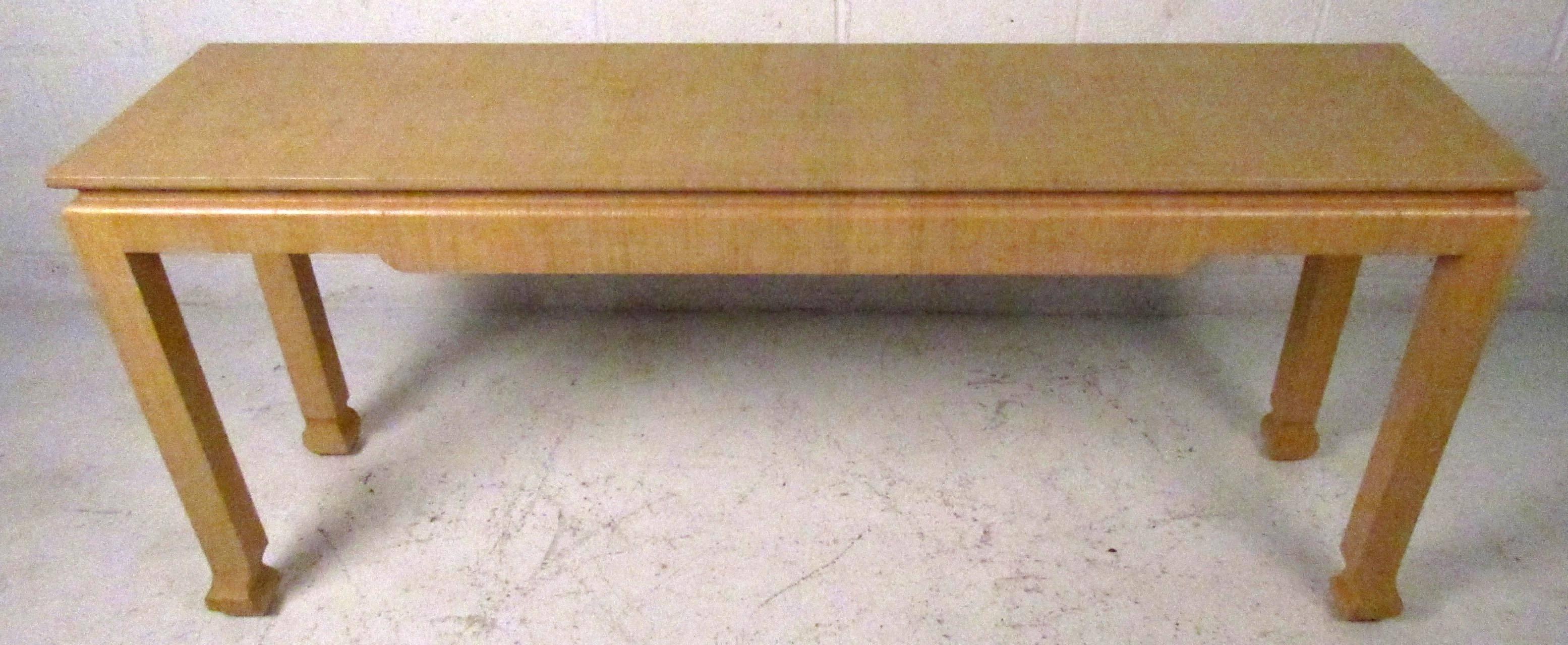Vintage-modern console table, features sculpted base and grass cloth finish, designed in the manner of Karl Springer.

Please confirm item location NY or NJ with dealer.