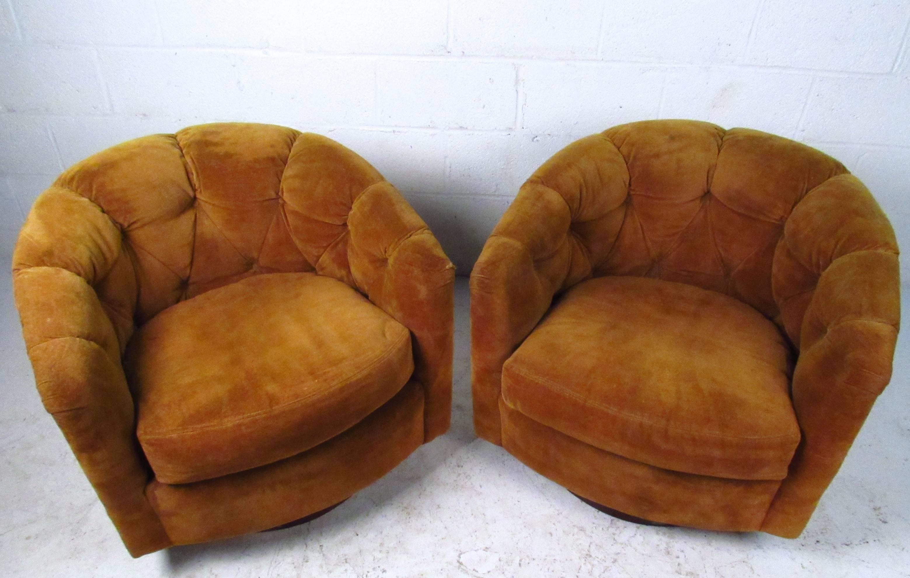 This beautiful vintage pair of Selig Monroe club chairs offers a wonderful mix of comfort and style. Tufted barrel back design and swivel capabilities make these the perfect fit for any interior. Please confirm item location (NY or NJ).