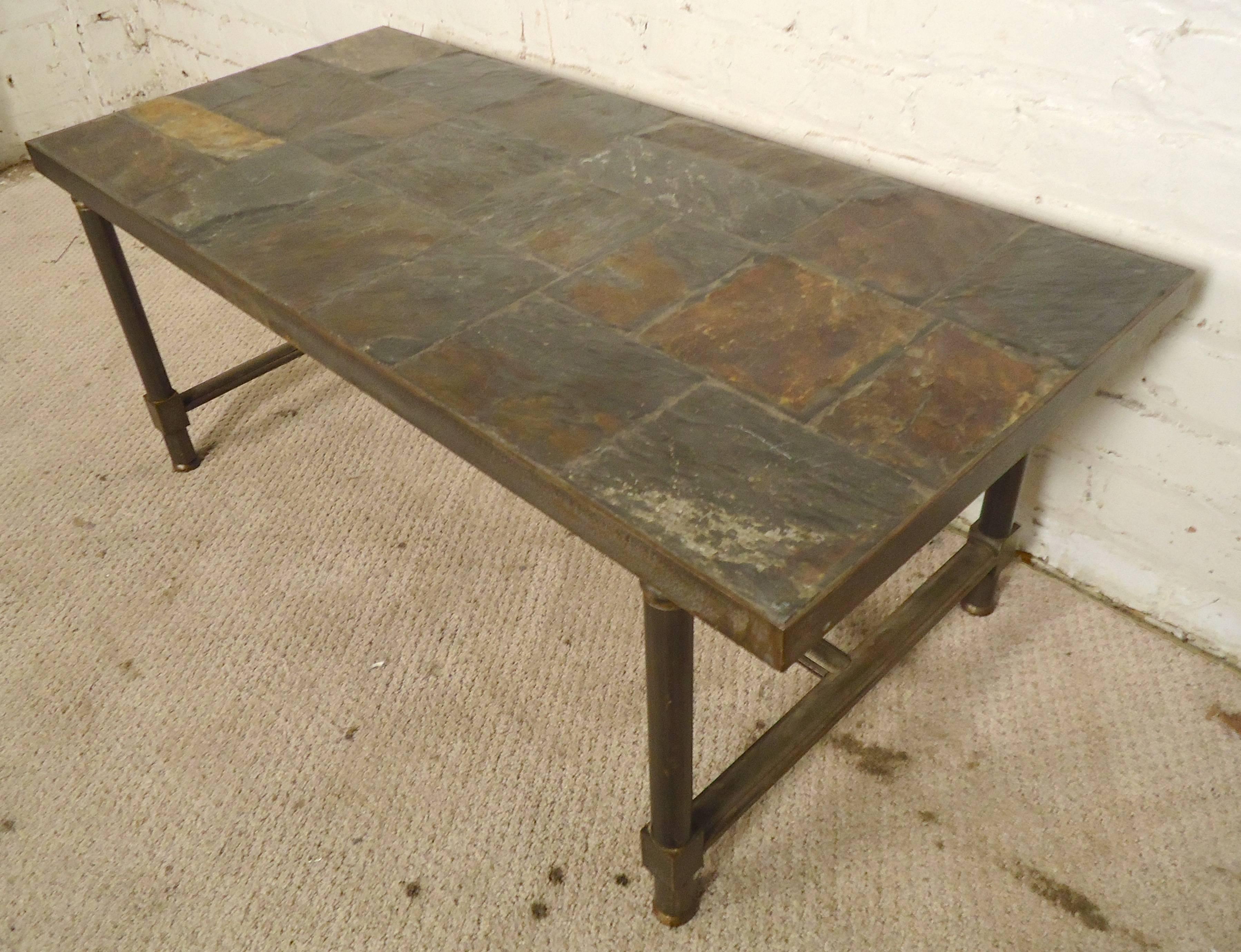 Beautiful iron table with patchwork style slate top. This heavy duty table can be used indoors or out.

(Please confirm item location - NY or NJ - with dealer)
