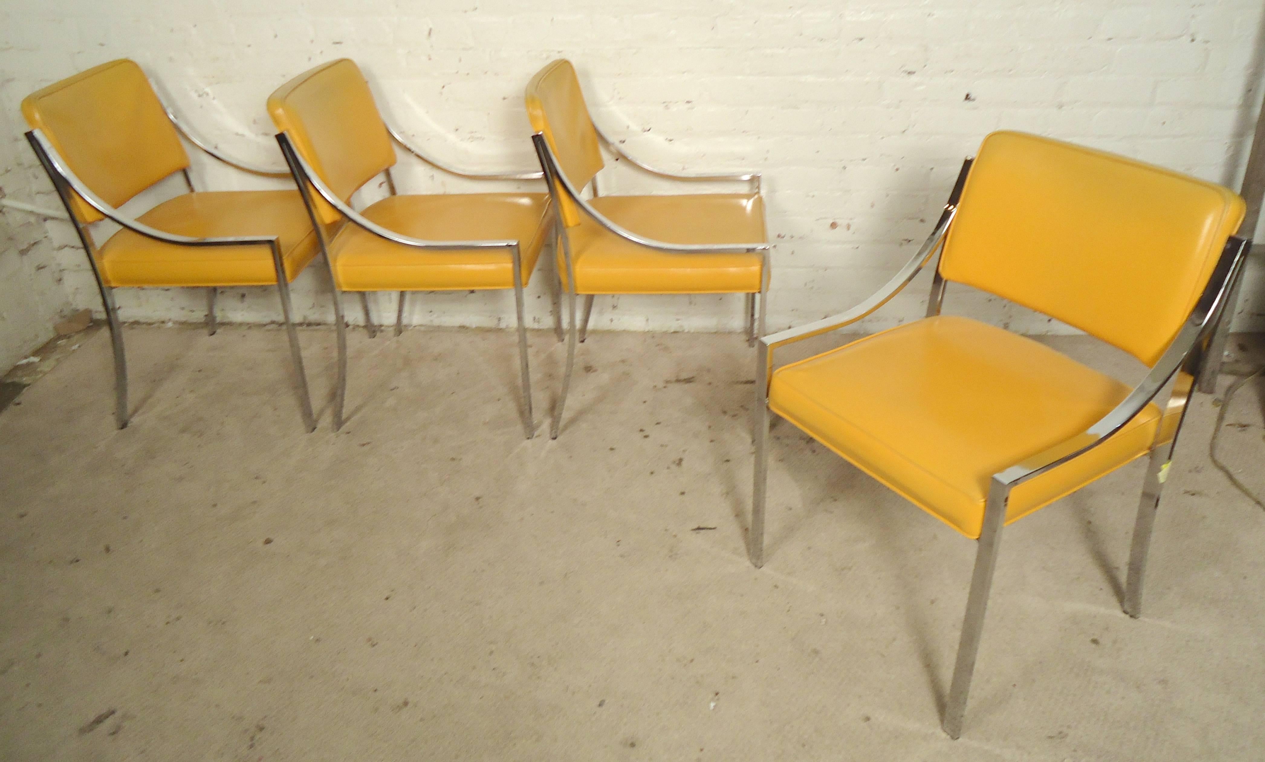 Set of four Milo Baughman style arm chairs with polished chrome frames. Attractive arching lines with cushioned seat and back.

(Please confirm item location - NY or NJ - with dealer)
